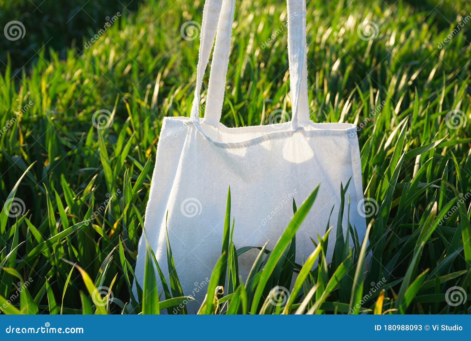 Eco Bag. White Bag in the Green Grass, Close-up. Field of Wheat Stock ...