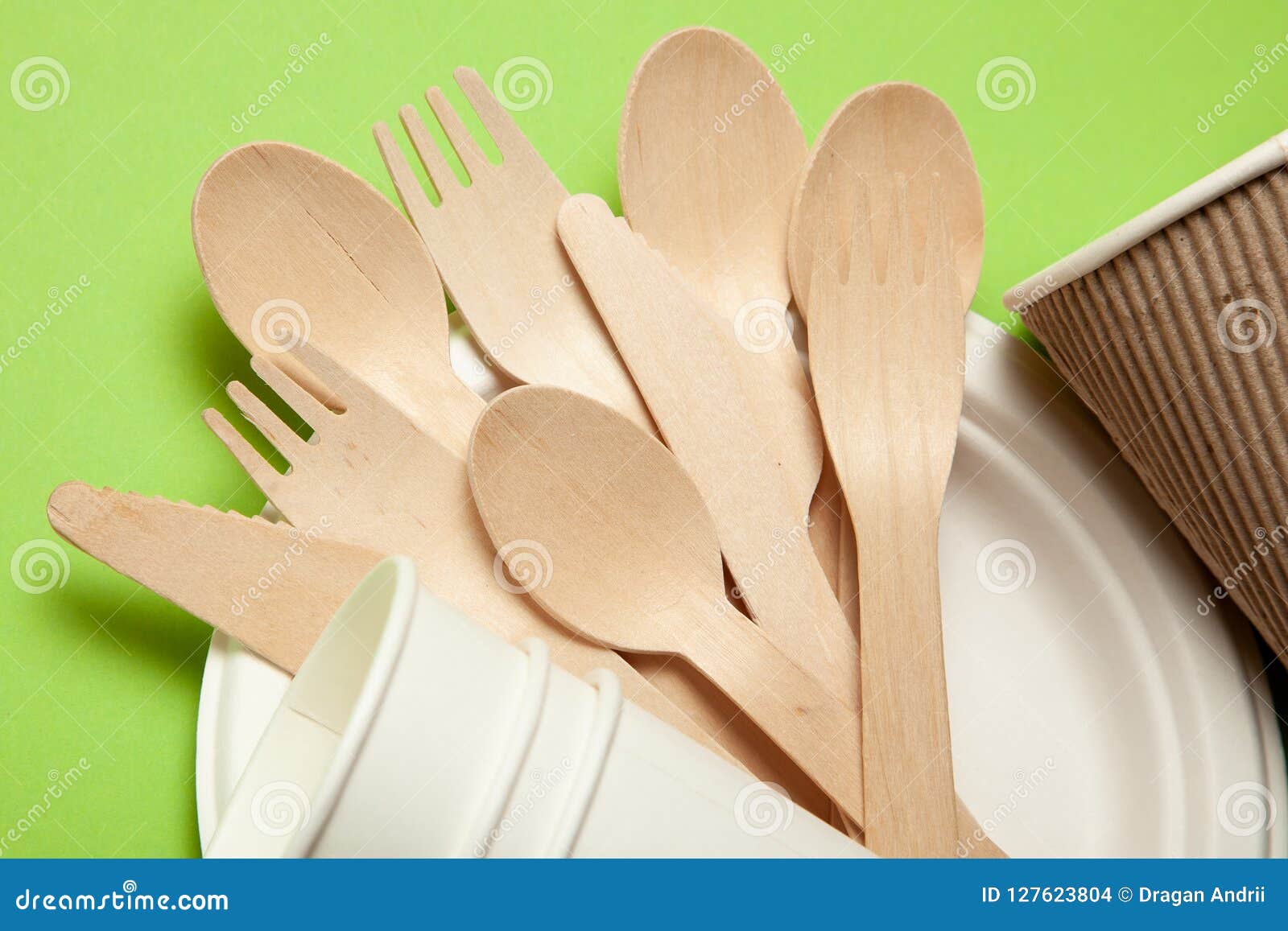 Ecofriendly Disposable Utensils Made of Bamboo Wood and Paper on a