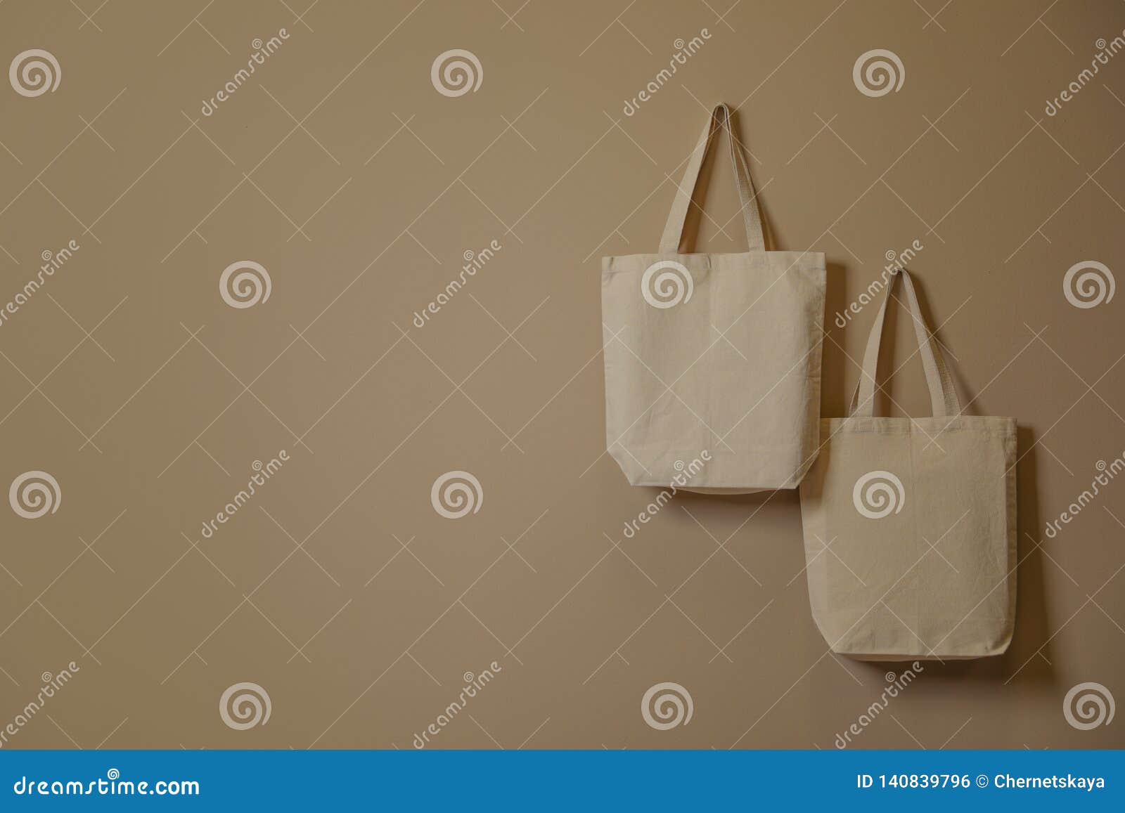 Download Eco Tote Bags Hanging On Color Wall. Stock Photo - Image ...