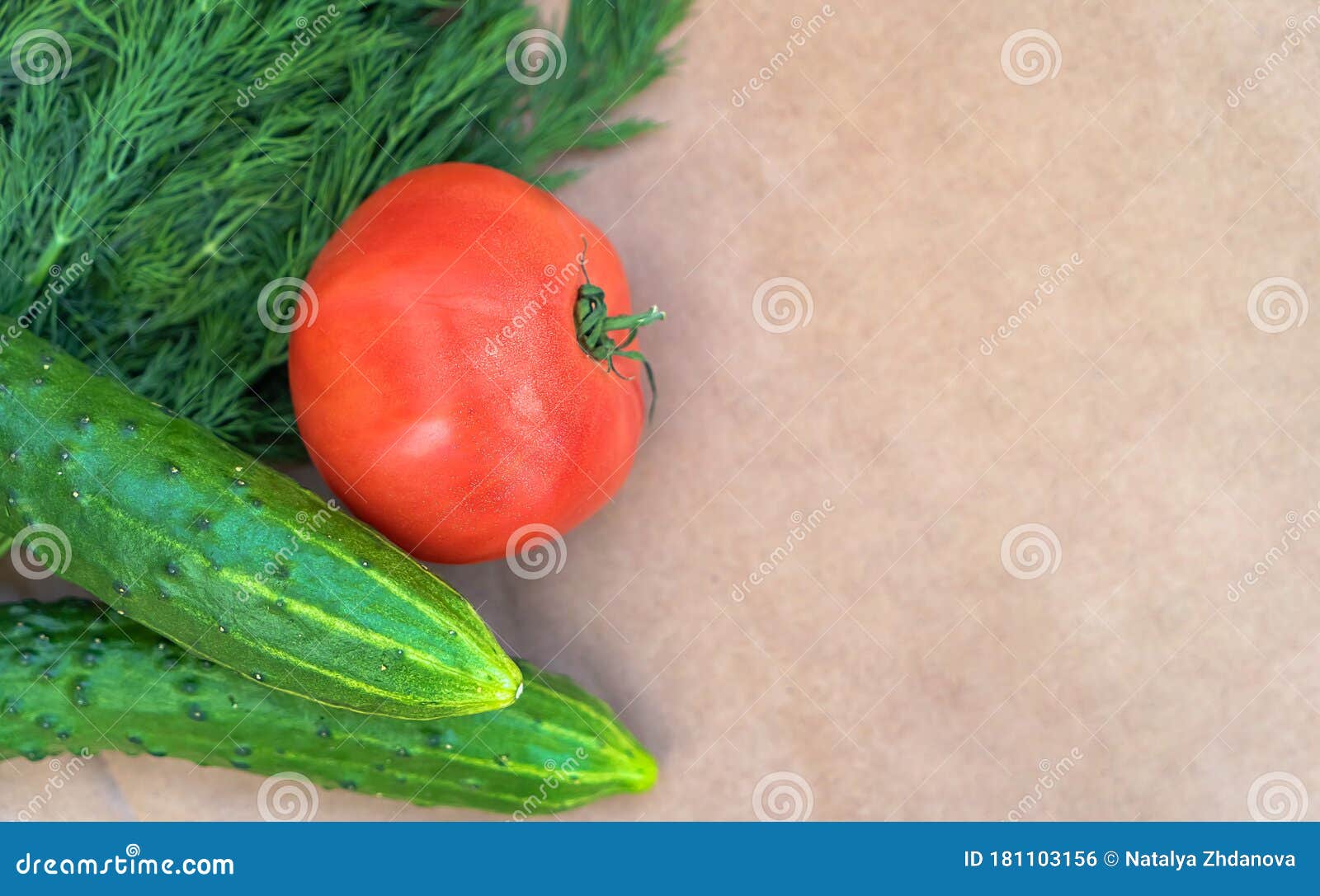 eco-vegetables on a paper background close-up with a copy space. tomatoes, cucumbers, dill top view. soft focus.