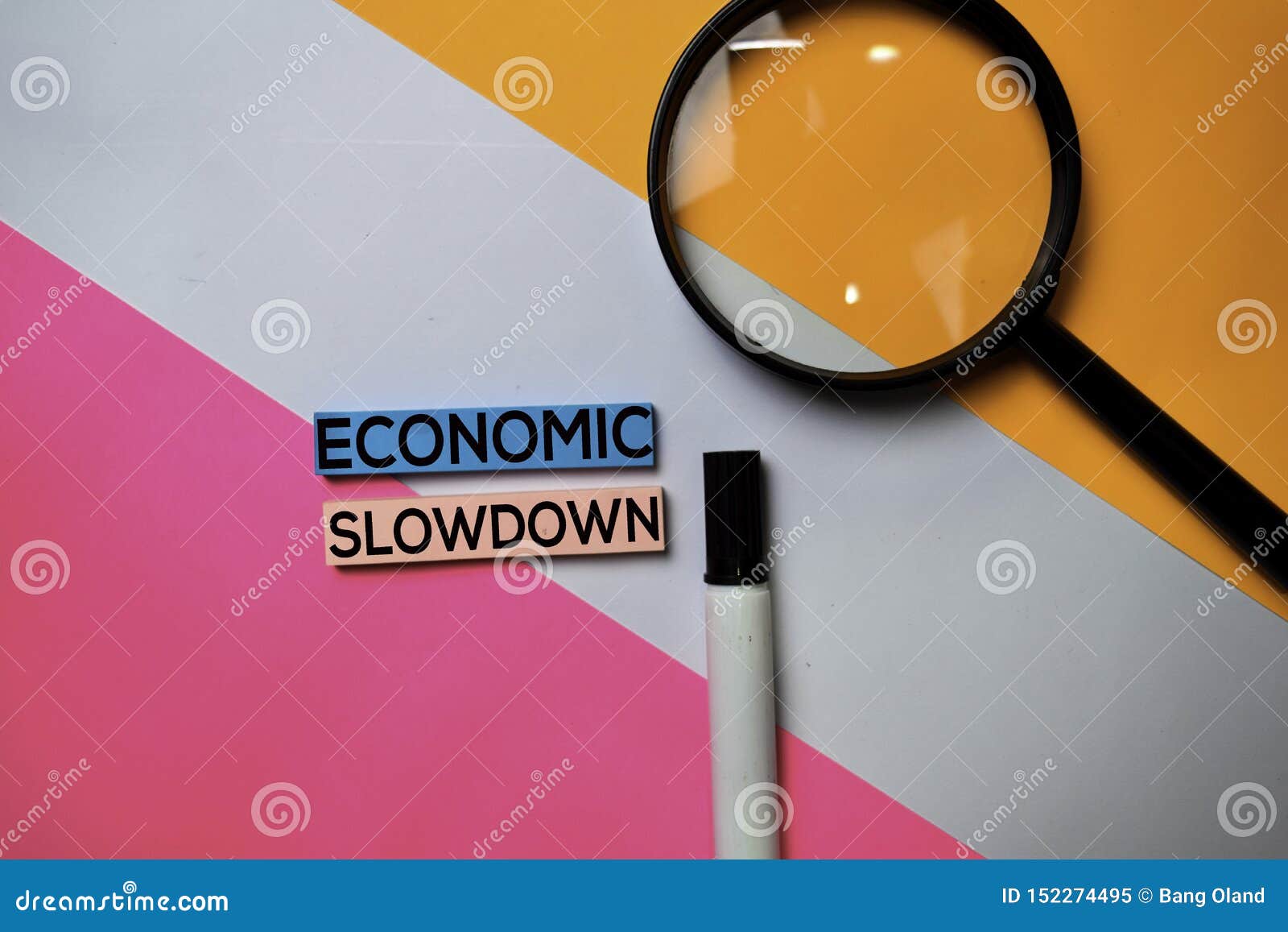 economic slowdown text on sticky notes with color office desk concept