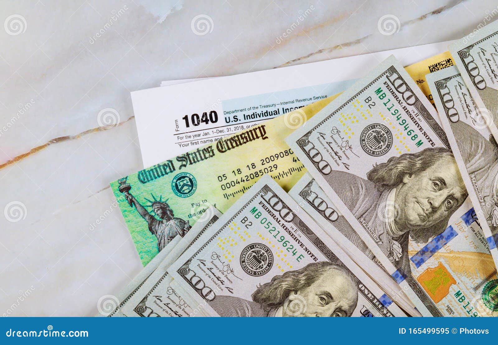stimulus-economic-tax-return-check-and-us-100-dollar-bills-currency
