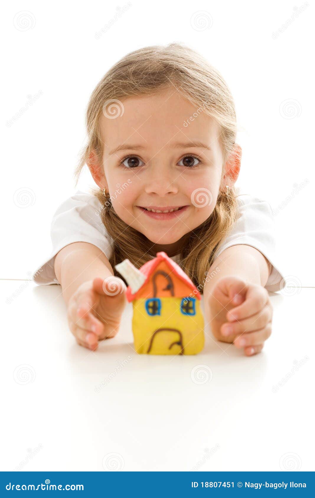 ecstatic little girl with her clay house