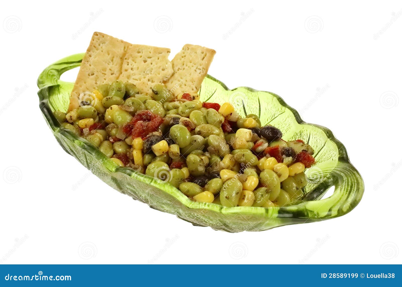 Edamame Soy Bean Salad Crackers. A green glass serving dish with edamame soy bean salad and crackers.