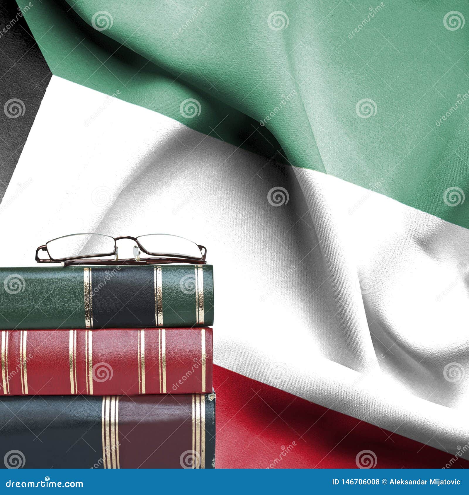 Education Concept Stack of Books and Reading Glasses Against National