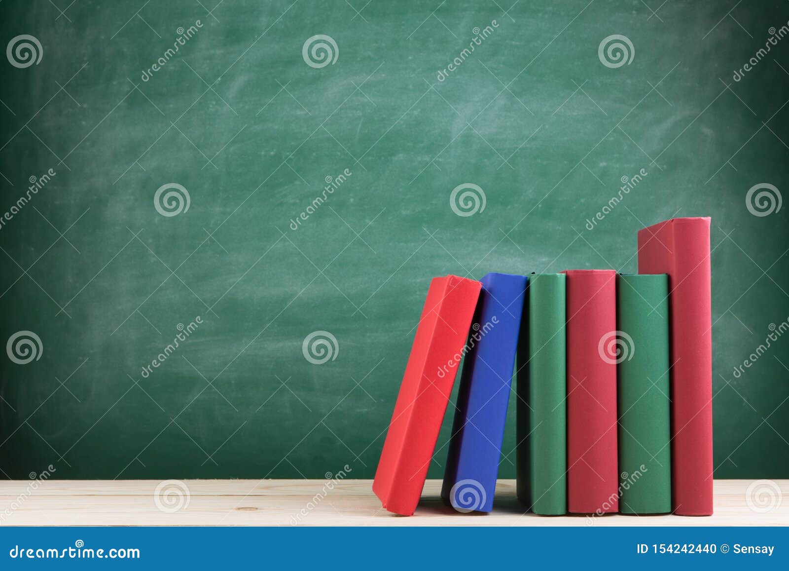 Education and Reading Concept - Group of Colorful Books on the Wooden Table  in the Classroom, Blackboard Background Stock Photo - Image of university,  science: 154242440