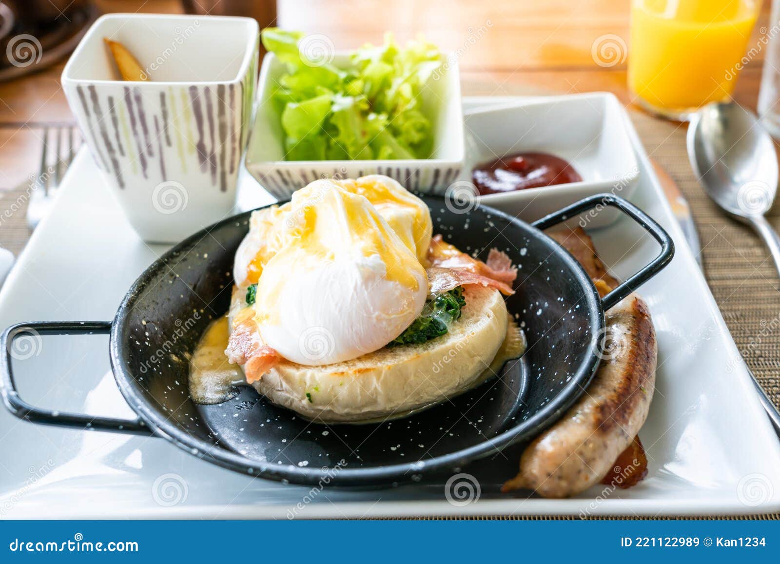 Egg Benedict with Bacon and Sausage Delicious American Breakfast