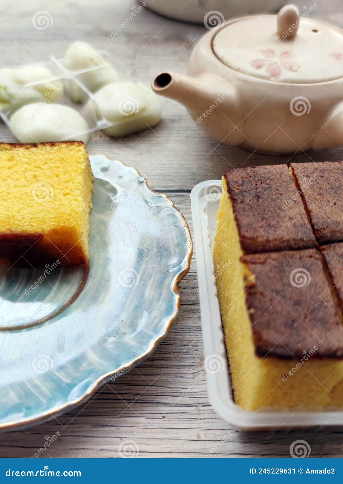 Egg Biscuit, Japanese Mochi Dessert and Teapot on the Table Stock Image
