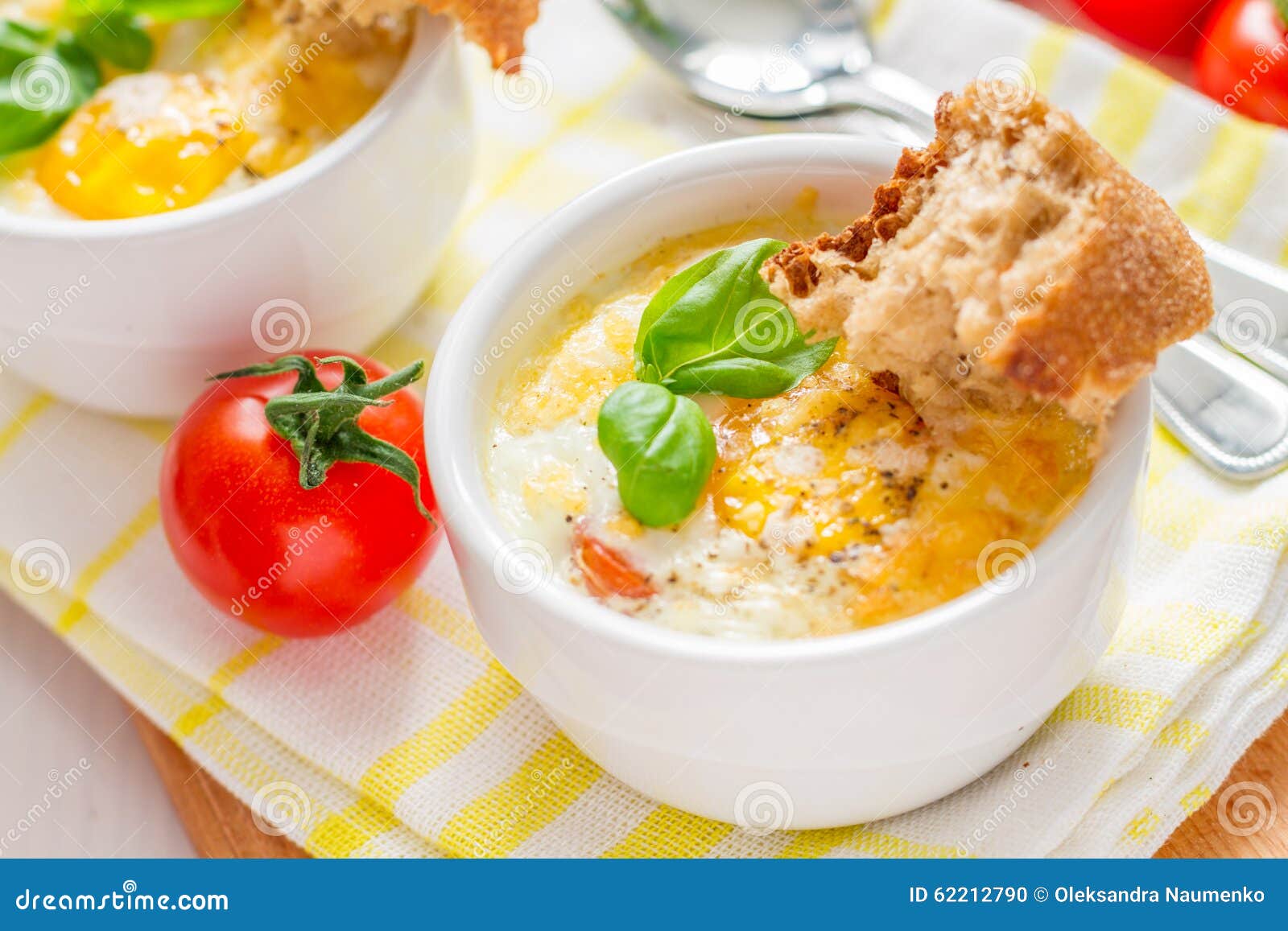 Egg Cocotte in White Ramekin with Tomato and Basil Stock Photo Image