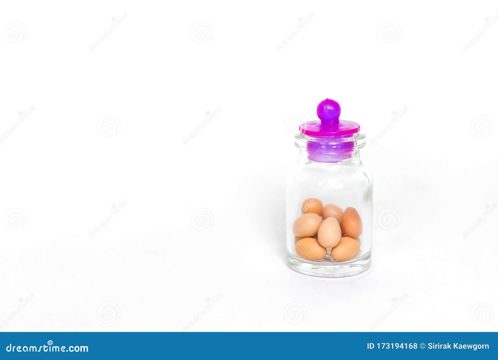 Egg in Glass Bottle Isolate on White Background, Small Eggs Keep in