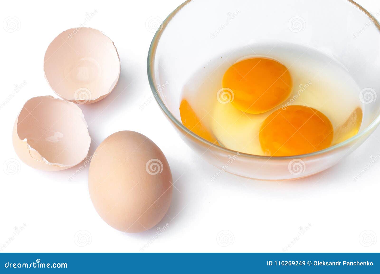 Egg, Hen Eggs and Cracking Eggs in a Glass Bowl with Brown Eggs Stock