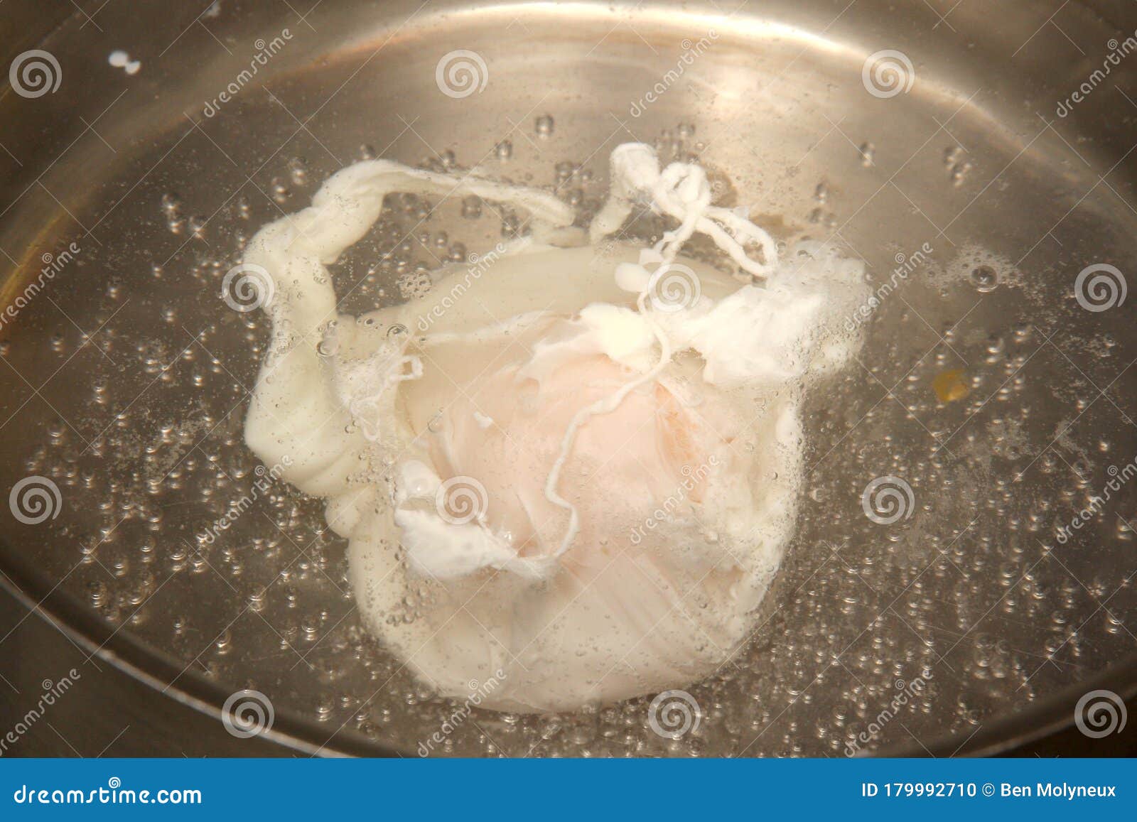 An Egg Poaching in Boiling Water Stock Photo Image of appliance