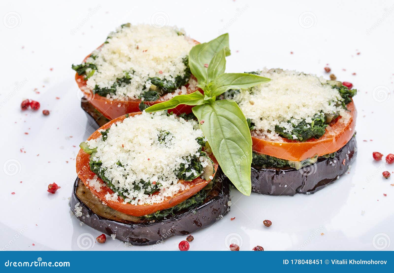 Eggplant Baked with Tomatoes and Spinach. on White Background Stock