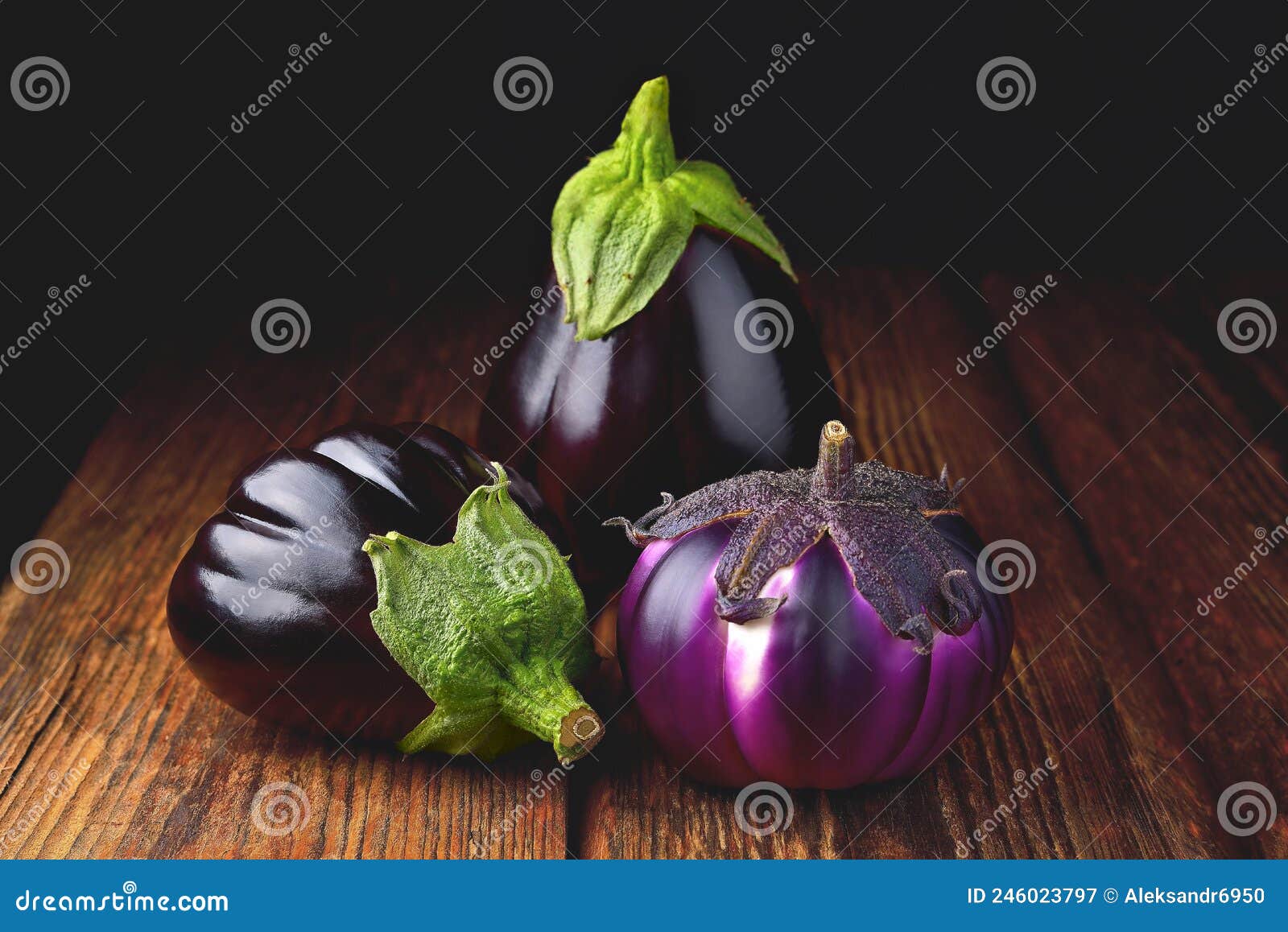 eggplant on wooden background, fresh juicy vegetable on wooden rustic background, selective focus, soft focus