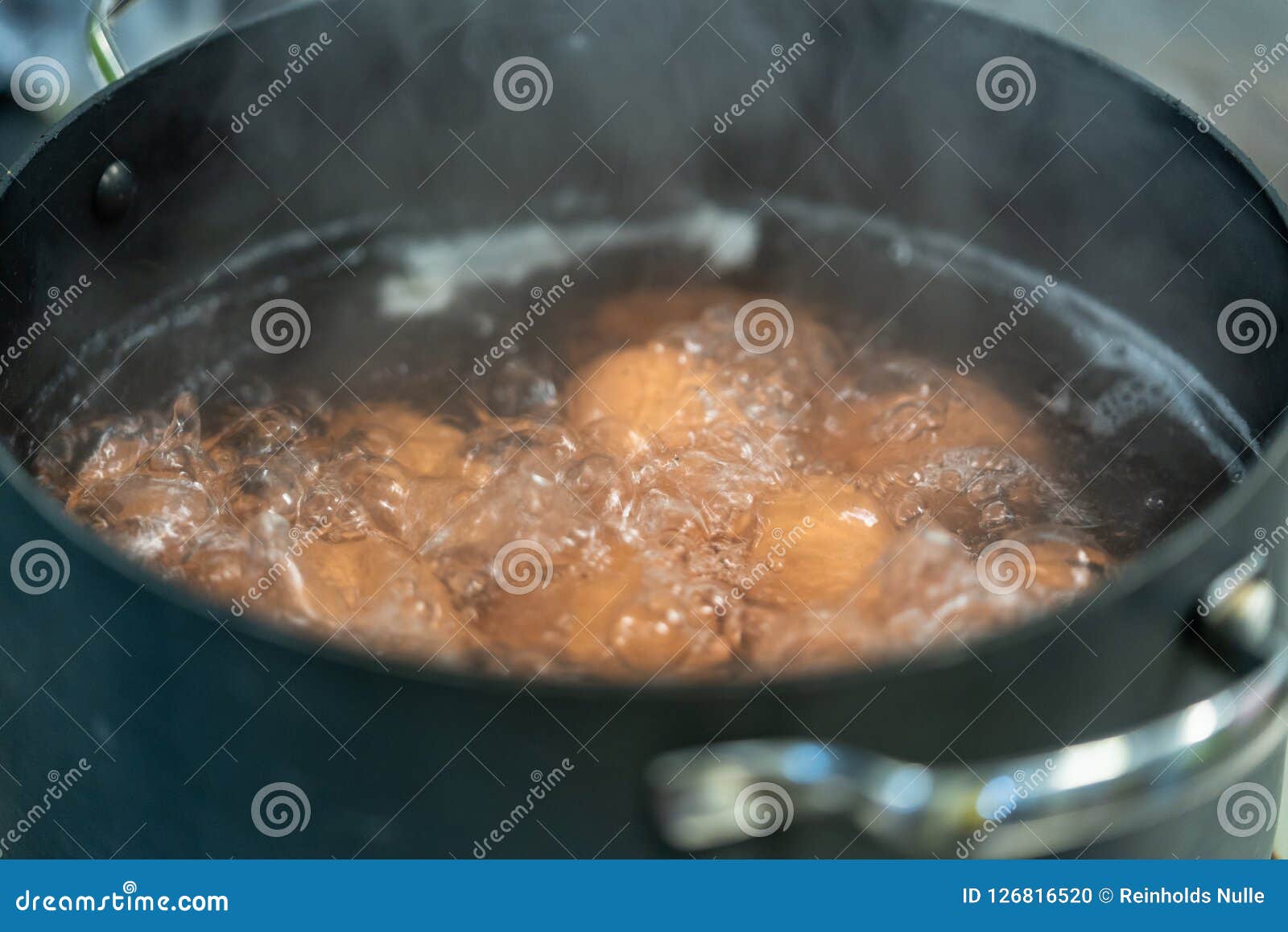Eggs Boiling in Water stock photo. Image of food, hard 126816520