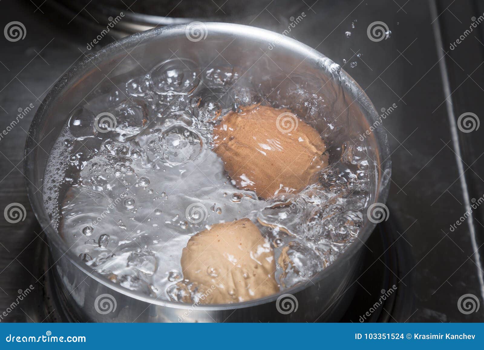 Eggs in boiling water stock photo. Image of kitchen 103351524