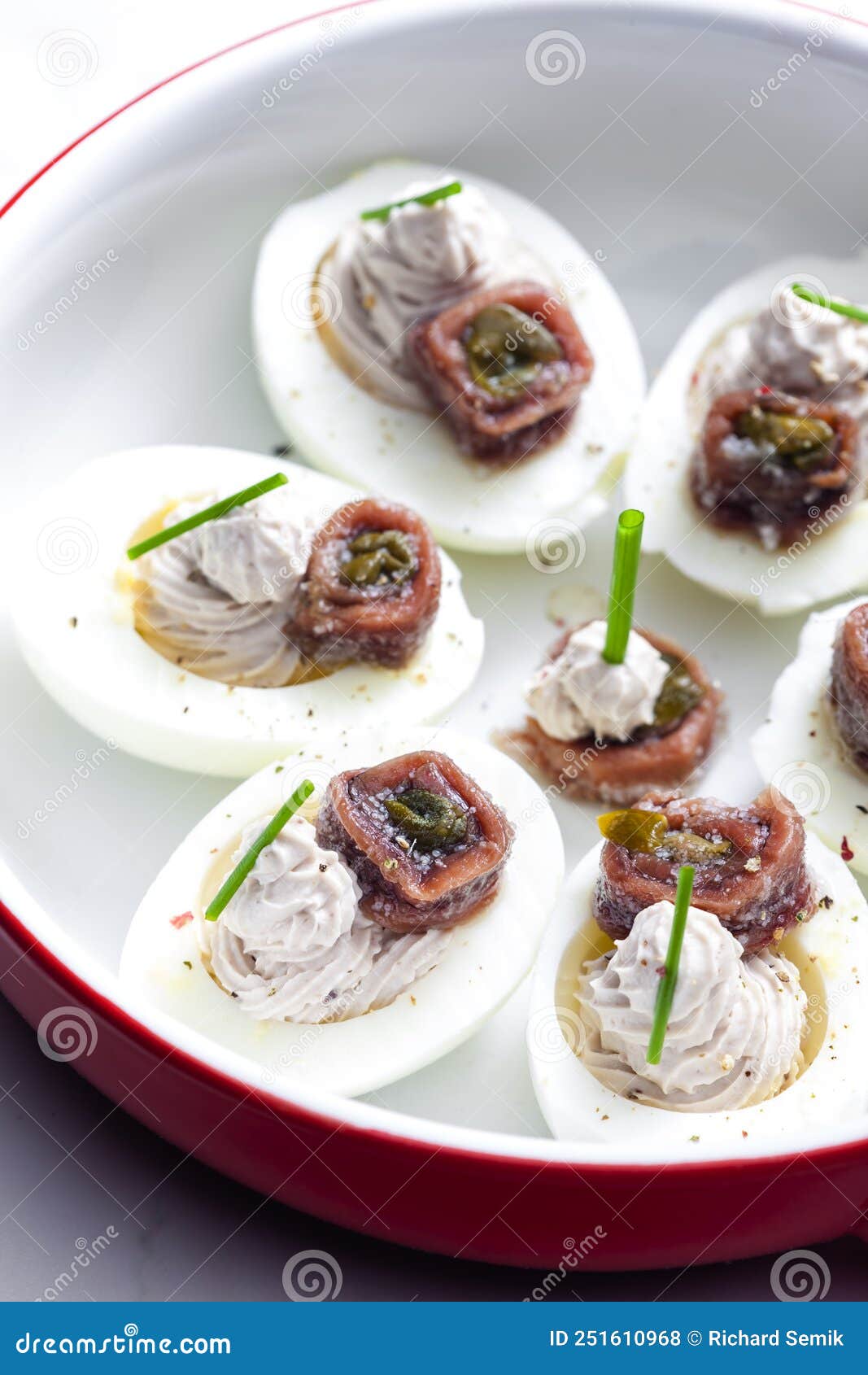 eggs filled with anchoa spread with anchoa on the top