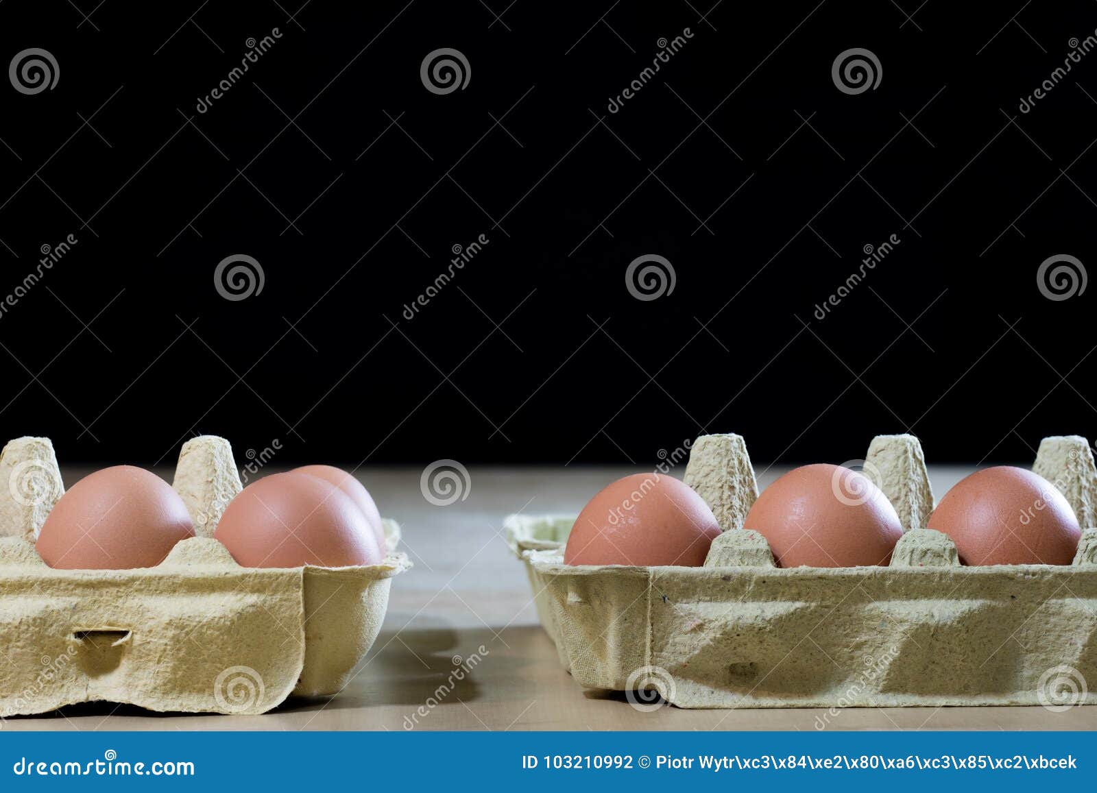 Eggs in Molds on a Wooden Kitchen Table. Hen Egg in the Kitchen Stock