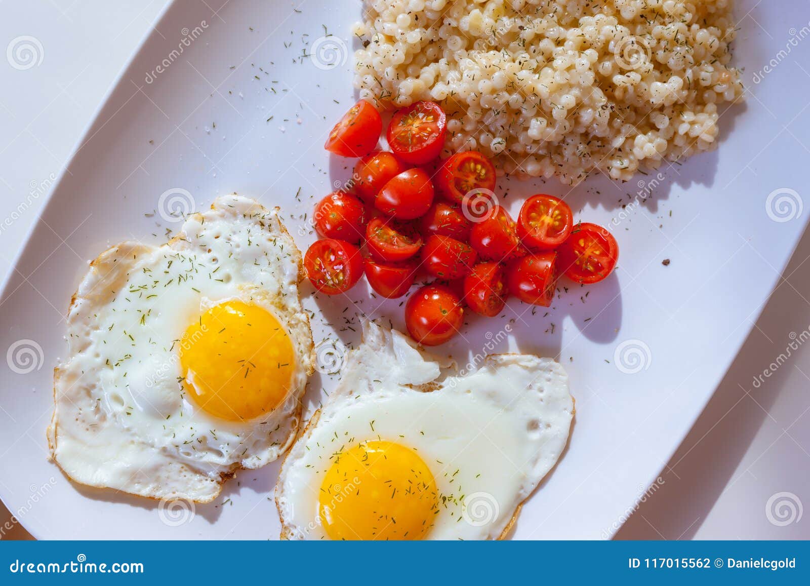 Eggs, Tomatoes and Couscous for Breakfast Stock Photo Image of food