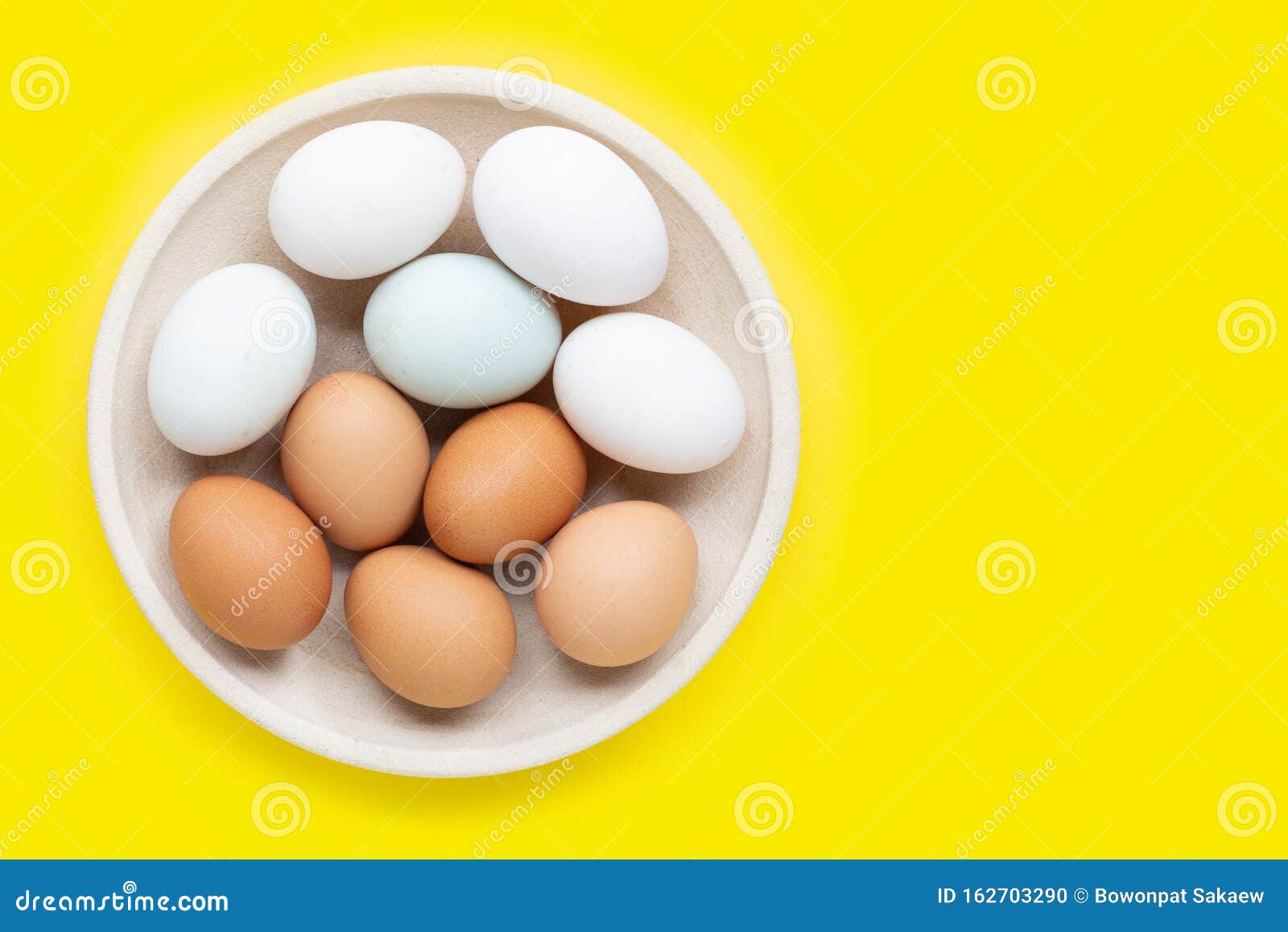 Eggs on yellow background stock photo. Image of carton 162703290