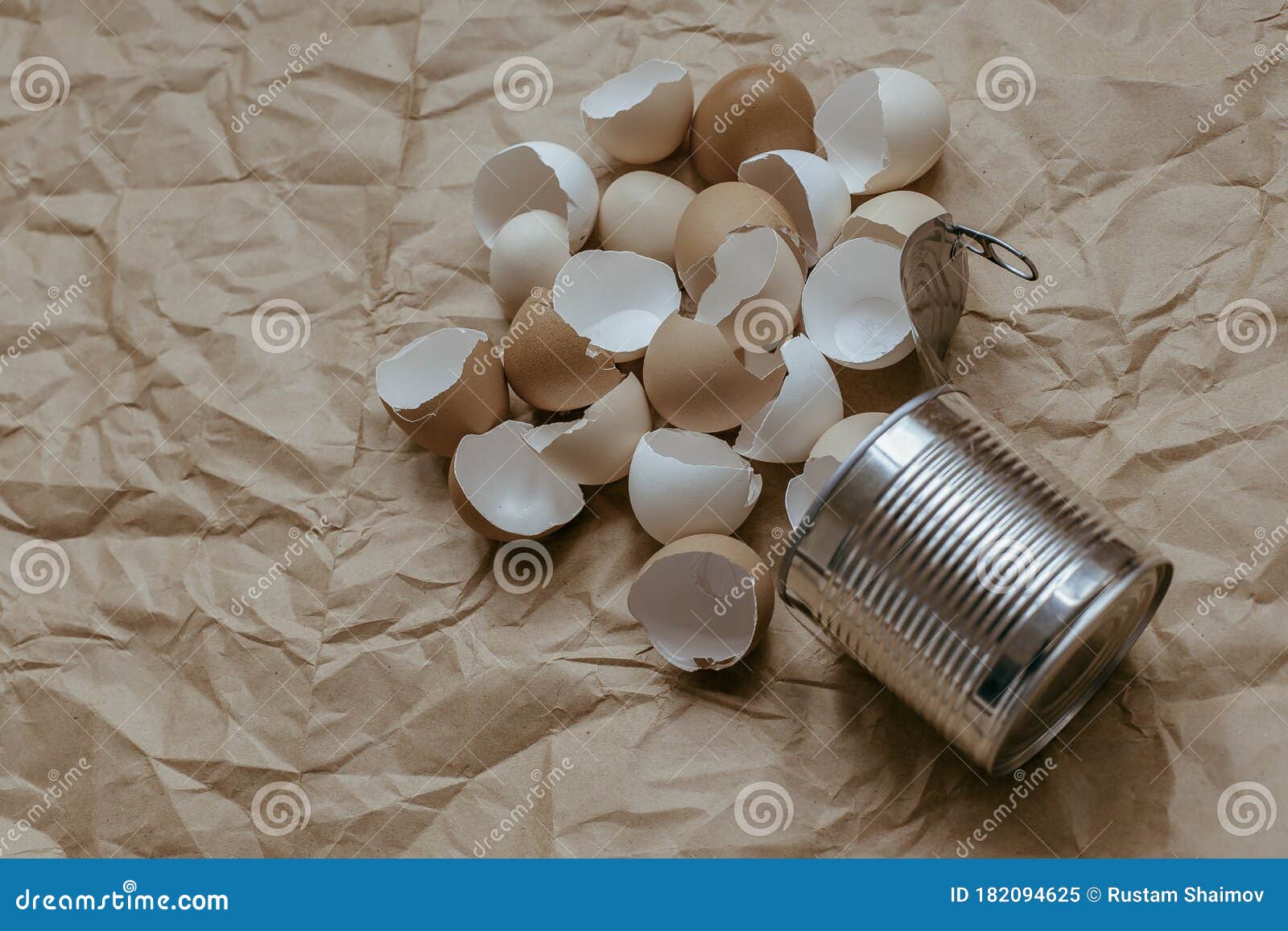 Eggshell in Tin Top View. Creative Still Life Photo of an Eggshell in a