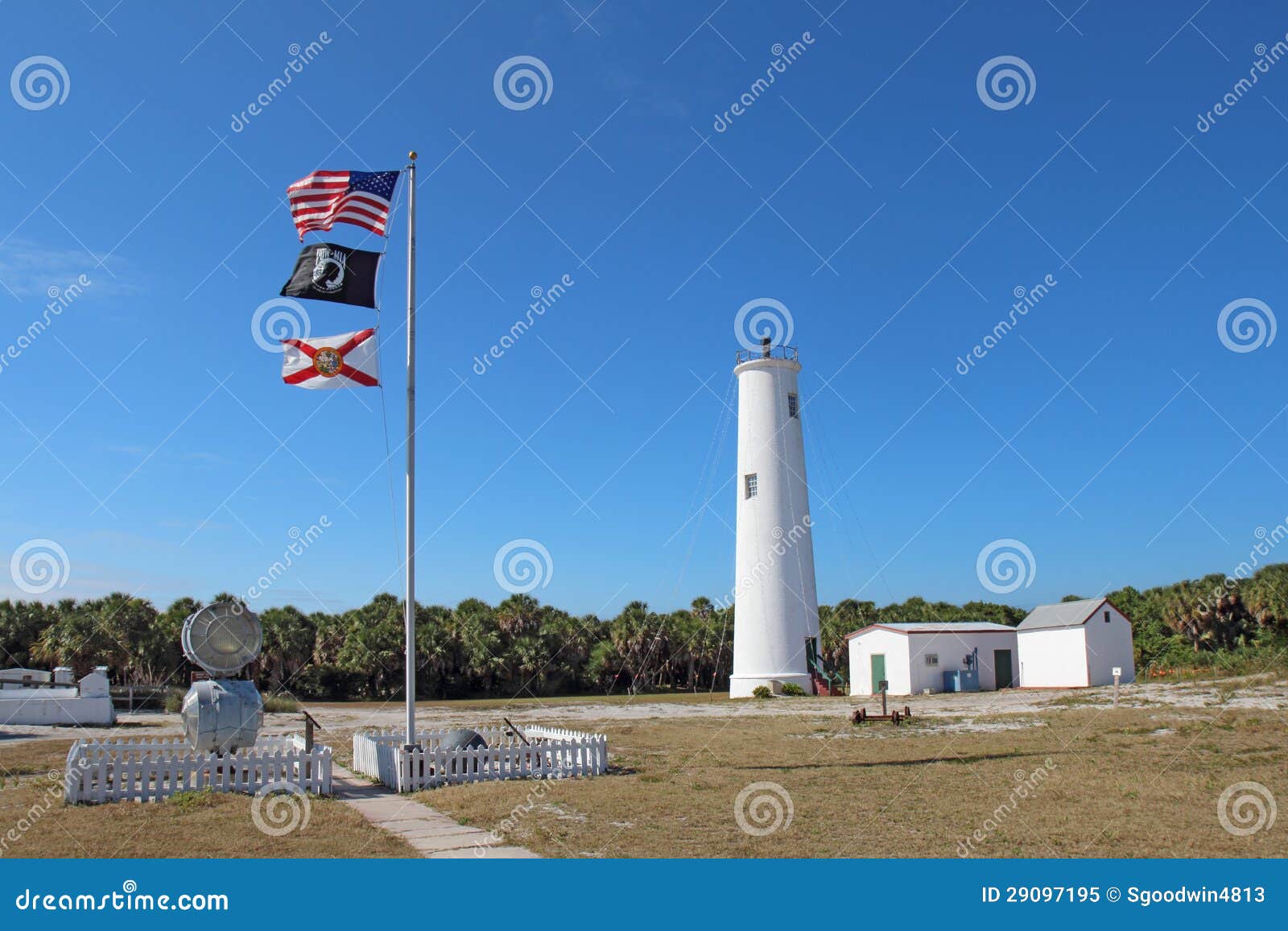 The Egmont Key Lighthouse and Flags in Tampa Bay, Florida Editorial