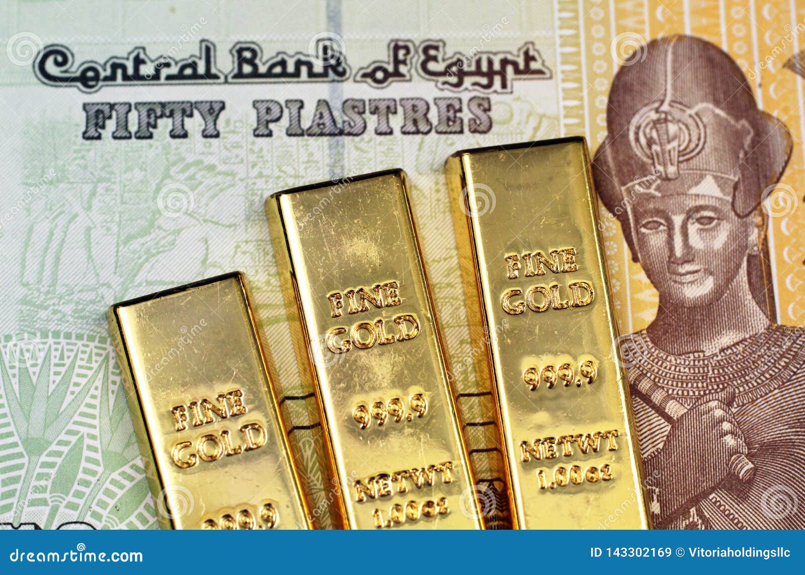 An Egyptian Fifty Piastre Note With An American One Hundred Dollar Bill an-egyptian-fifty-piastre-note-with-an-american-one-hundred-dollar-bill