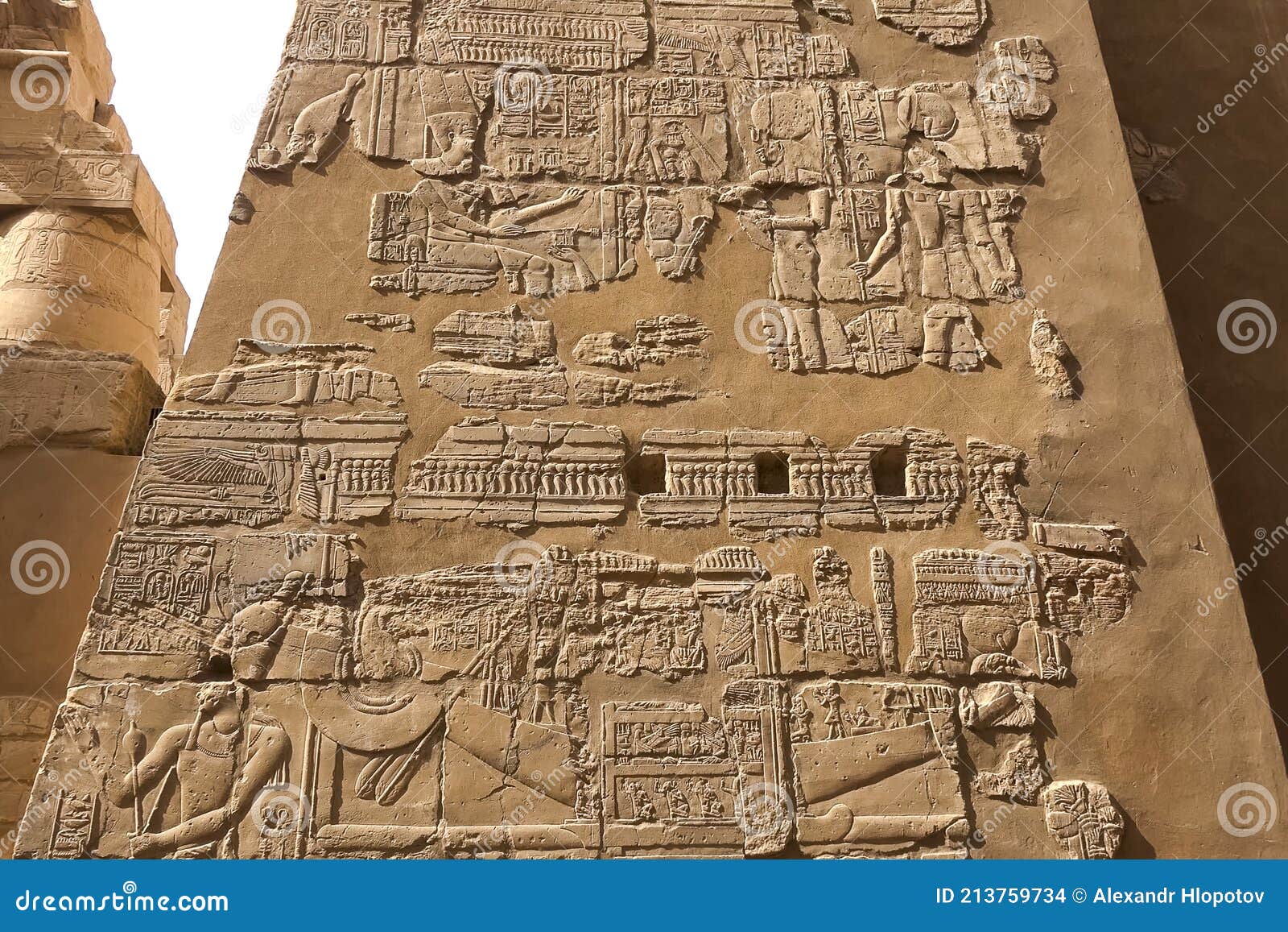 egyptian hieroglyphs and drawings on the walls and columns. egyptian language, the life of ancient gods and people in