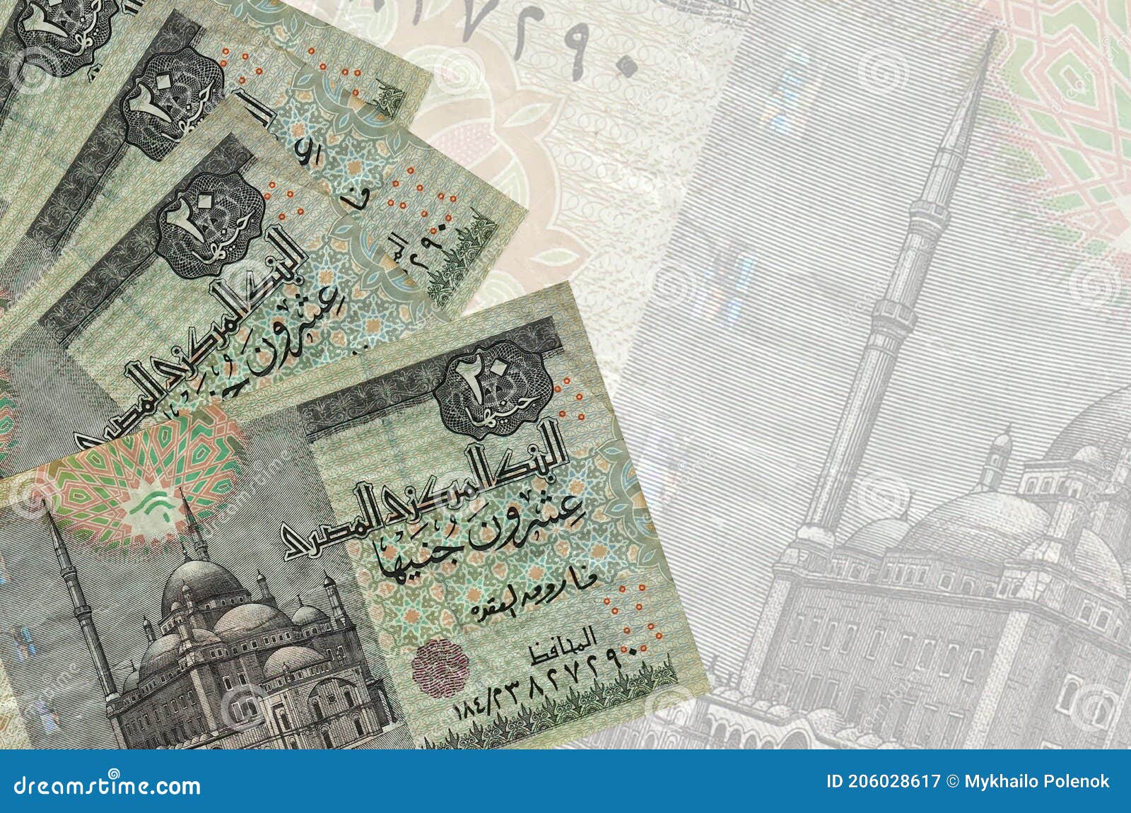 20 egyptian pounds bills lies in stack on background of big semi-transparent banknote. abstract business background