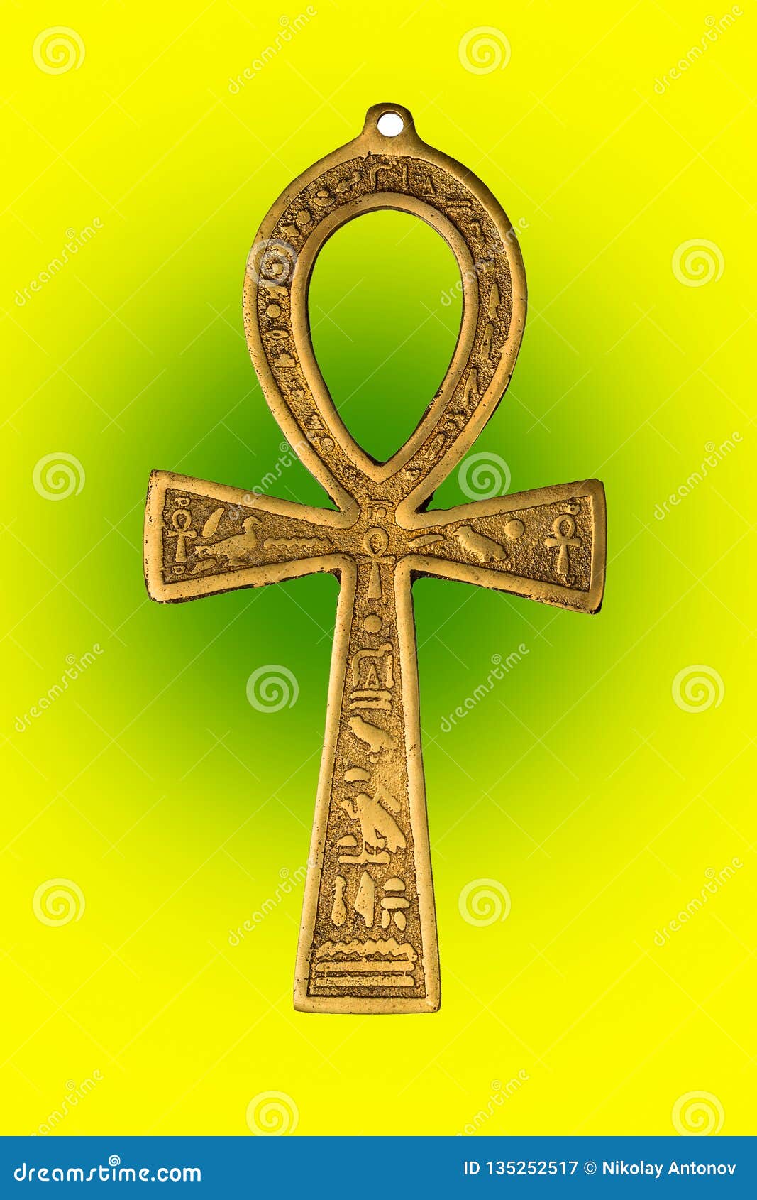 Egyptian Symbol Of Life Ankh On Yellow Green Background Close Up