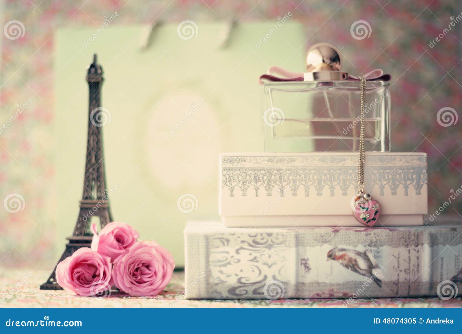 eiffel tower with roses and perfume bottle