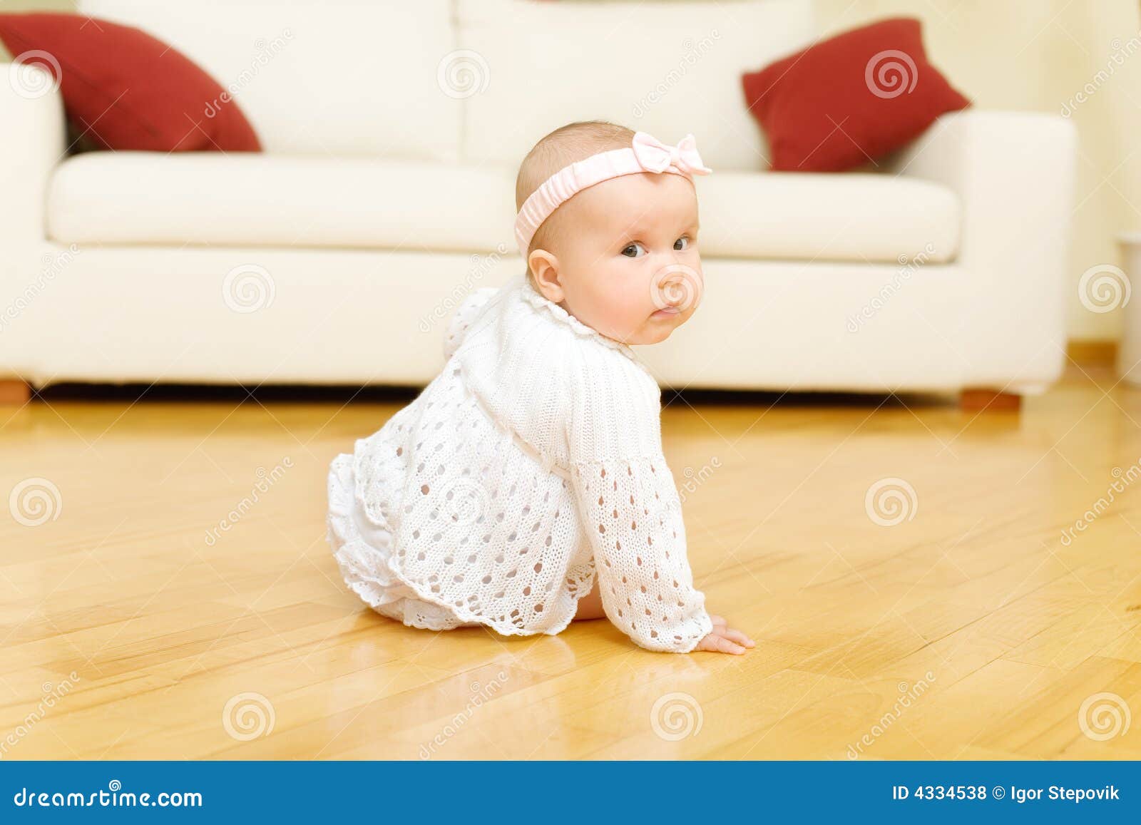 Eight Month Old Baby Girl Seated On A Floor Stock Photo - Image of