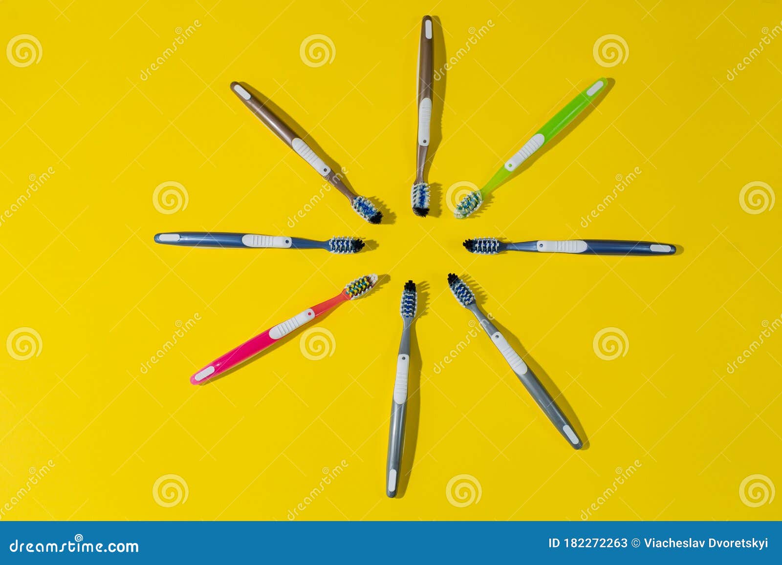 Eight Toothbrushes Lie on a Yellow Background in a Circle Stock Image ...