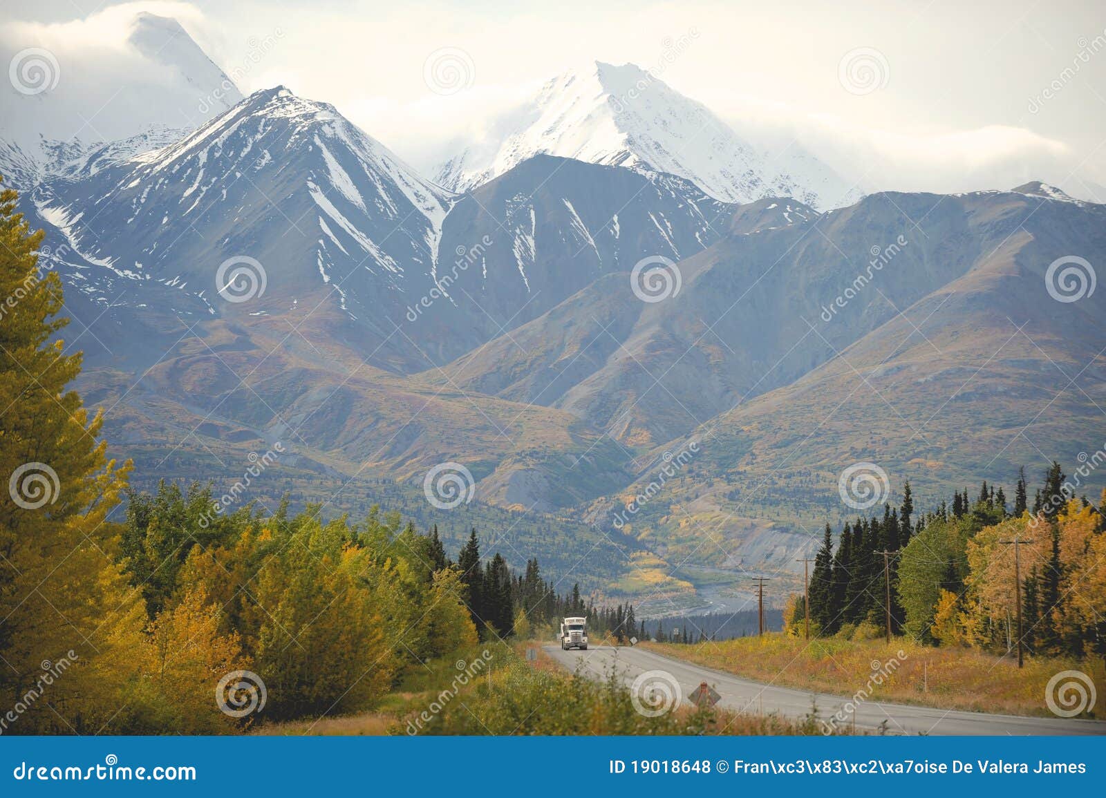eighteen-wheeler amongst yukon mountains, canada