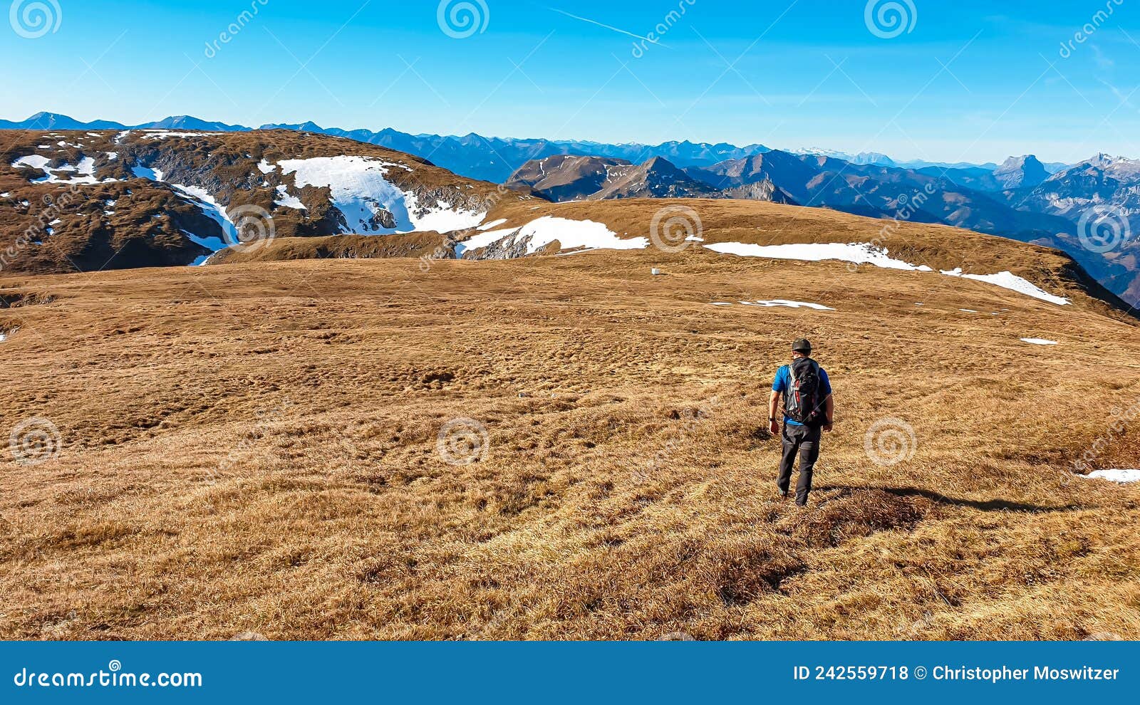 eisenerzer reichenstein - a man hiking on a an alpine pasture near eisenerz in styria, austria. wanderlust