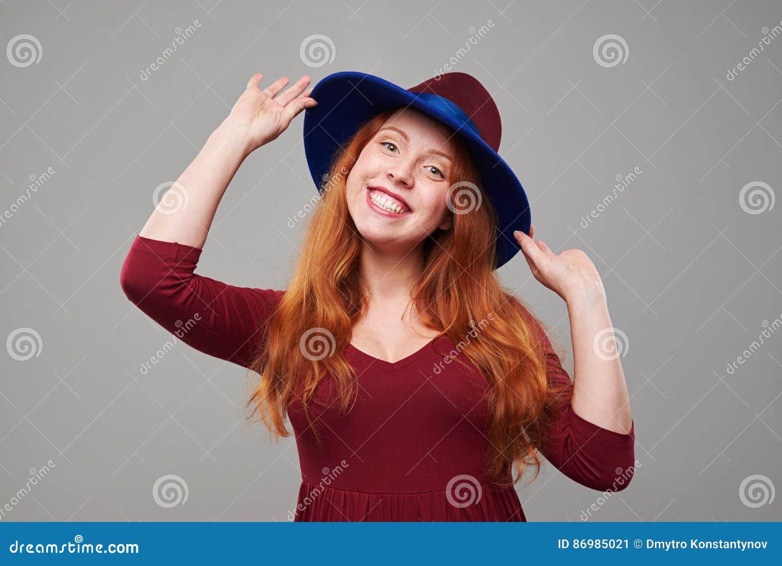 Elated Woman in Vinous Hat Isolated Over Background Stock Image picture