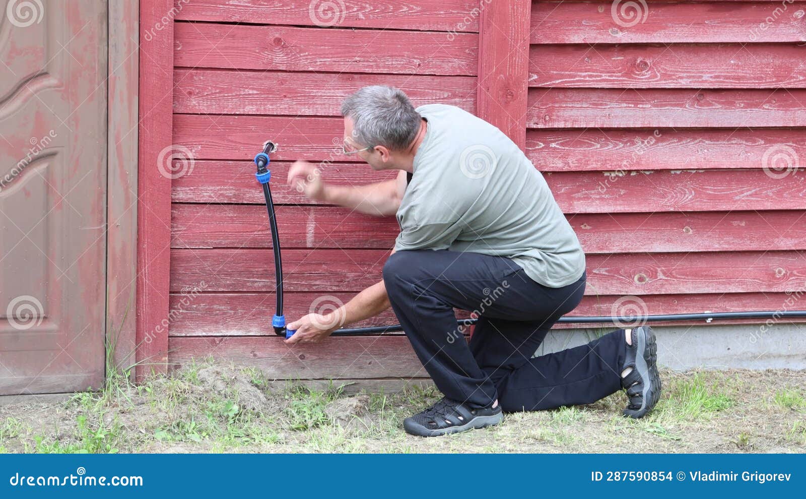 Elbow Connection on High Density Polyethylene Pipe, Man Tightens Collet