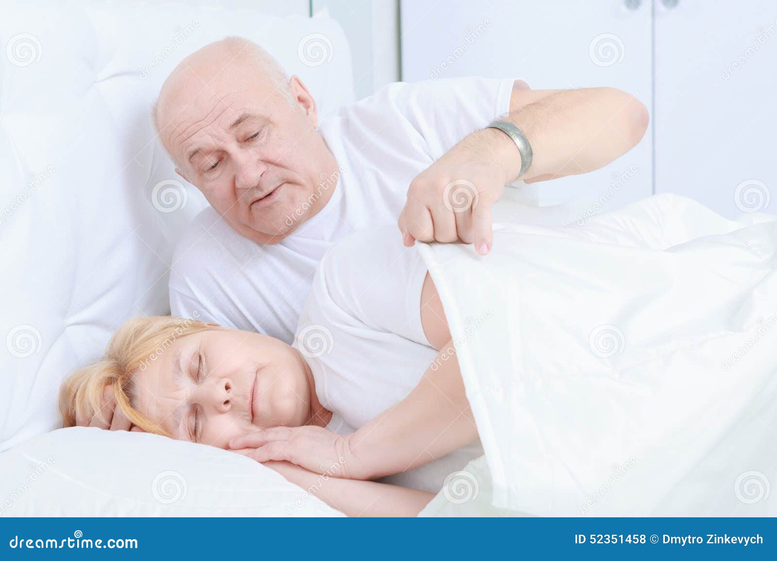 Elderly Couple Asleep in Bed Stock Photo photo