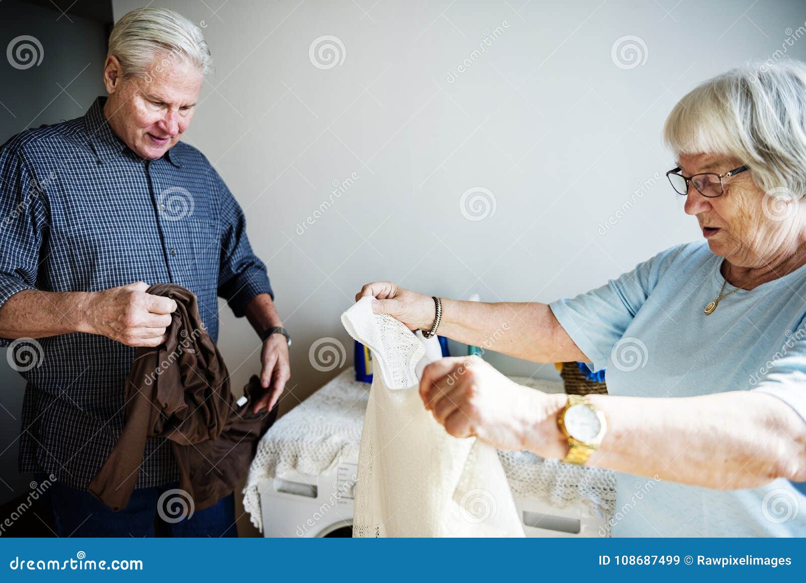 Elderly Couple Doing Laundry Together Stock Image Image of house