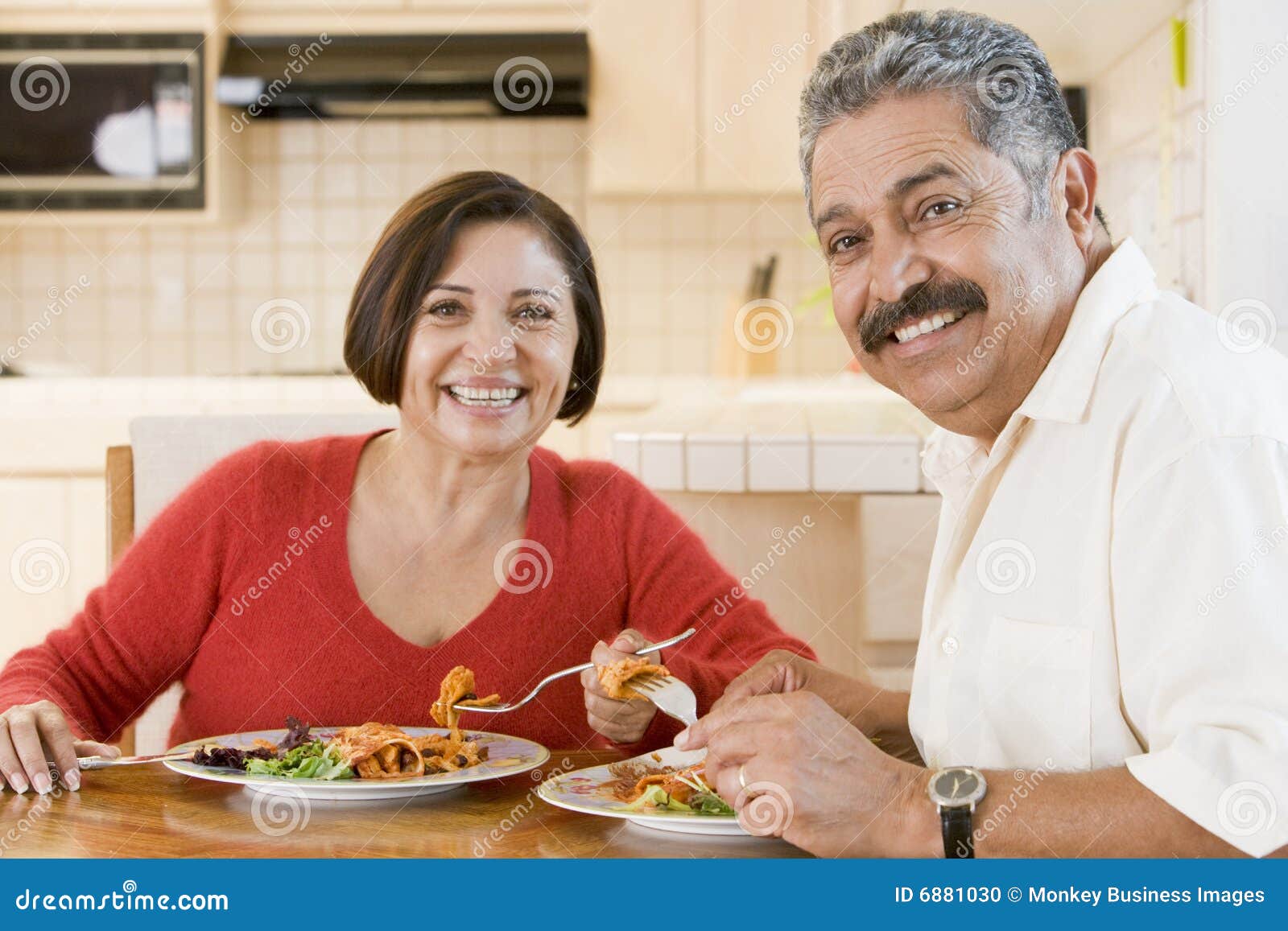 elderly couple enjoying meal,mealtime together