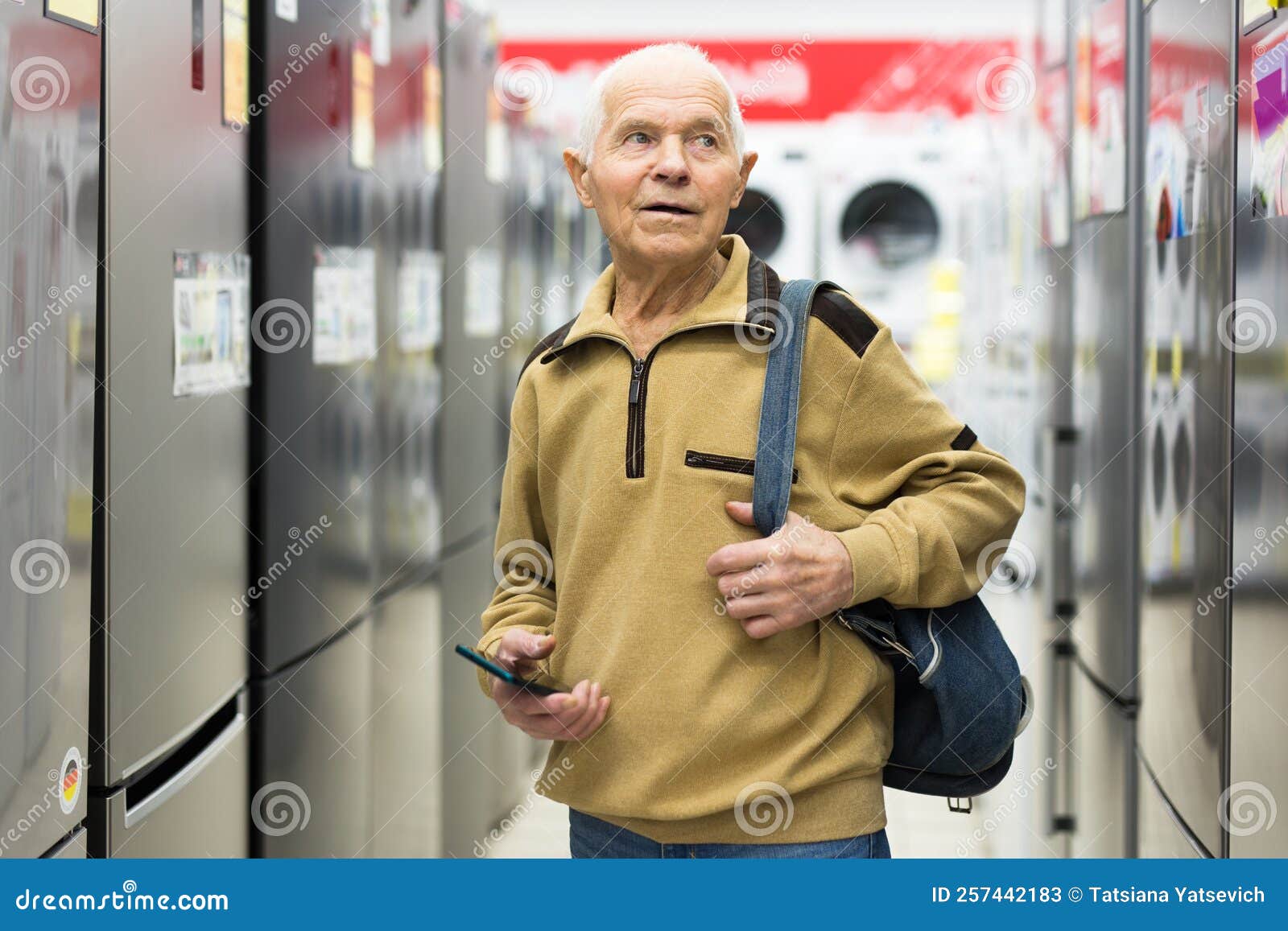 elderly grayhaired man pensioner examining counter with electronic