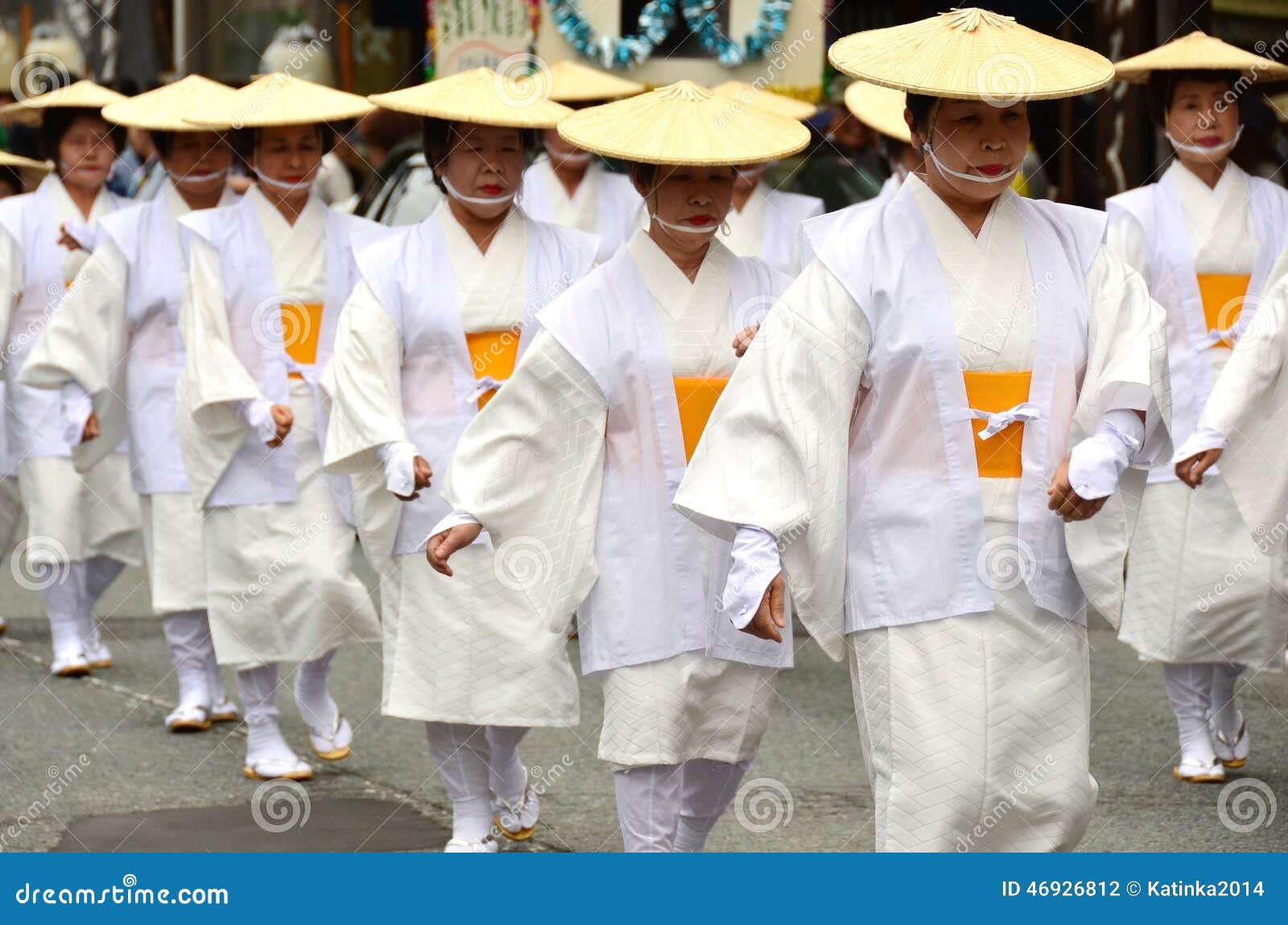 Mount Koya, Japan - June 14, 2011: Elderly Japanese dancers in white traditional clothes during Aoba festival, an annual event celebrating the birthday of Kobo Daishi (Kukai), one of Japan s most renowned Buddhist saints.