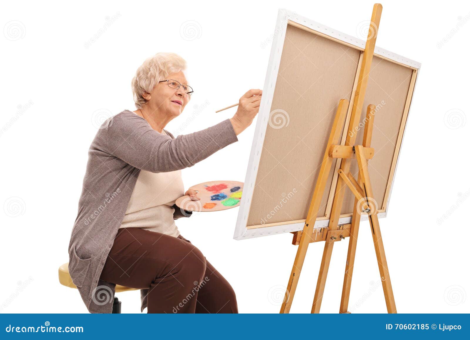 Elderly Lady Painting On A Canvas Stock Image - Image of elderly