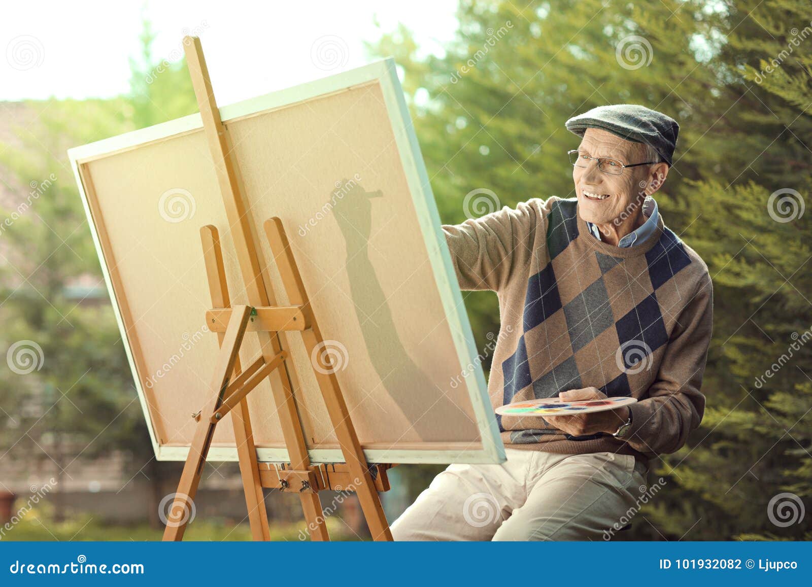 Elderly Man Painting on a Canvas Stock Photo Image of paintbrush