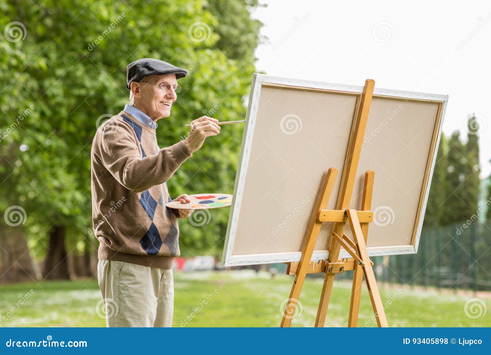 Elderly Man Painting on a Canvas Stock Photo Image of expression