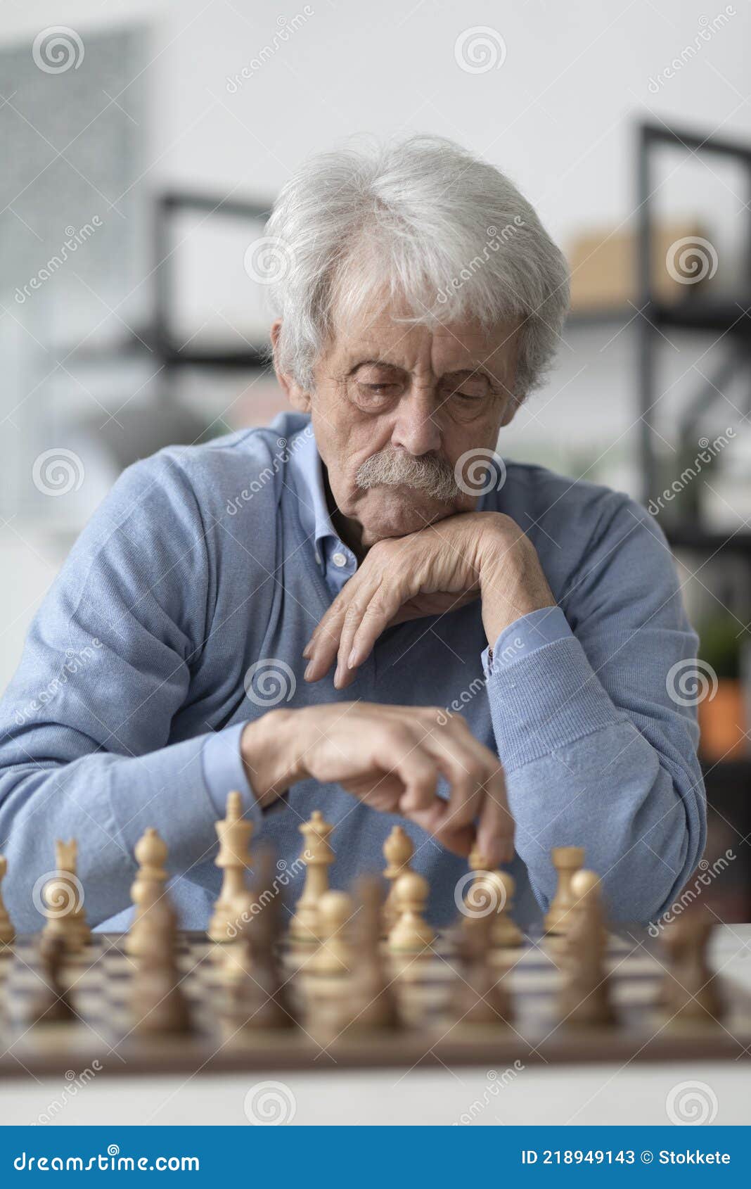 Premium Photo  Young bearded man in sunglasses sitting on a wooden park  bench planning his next chess move