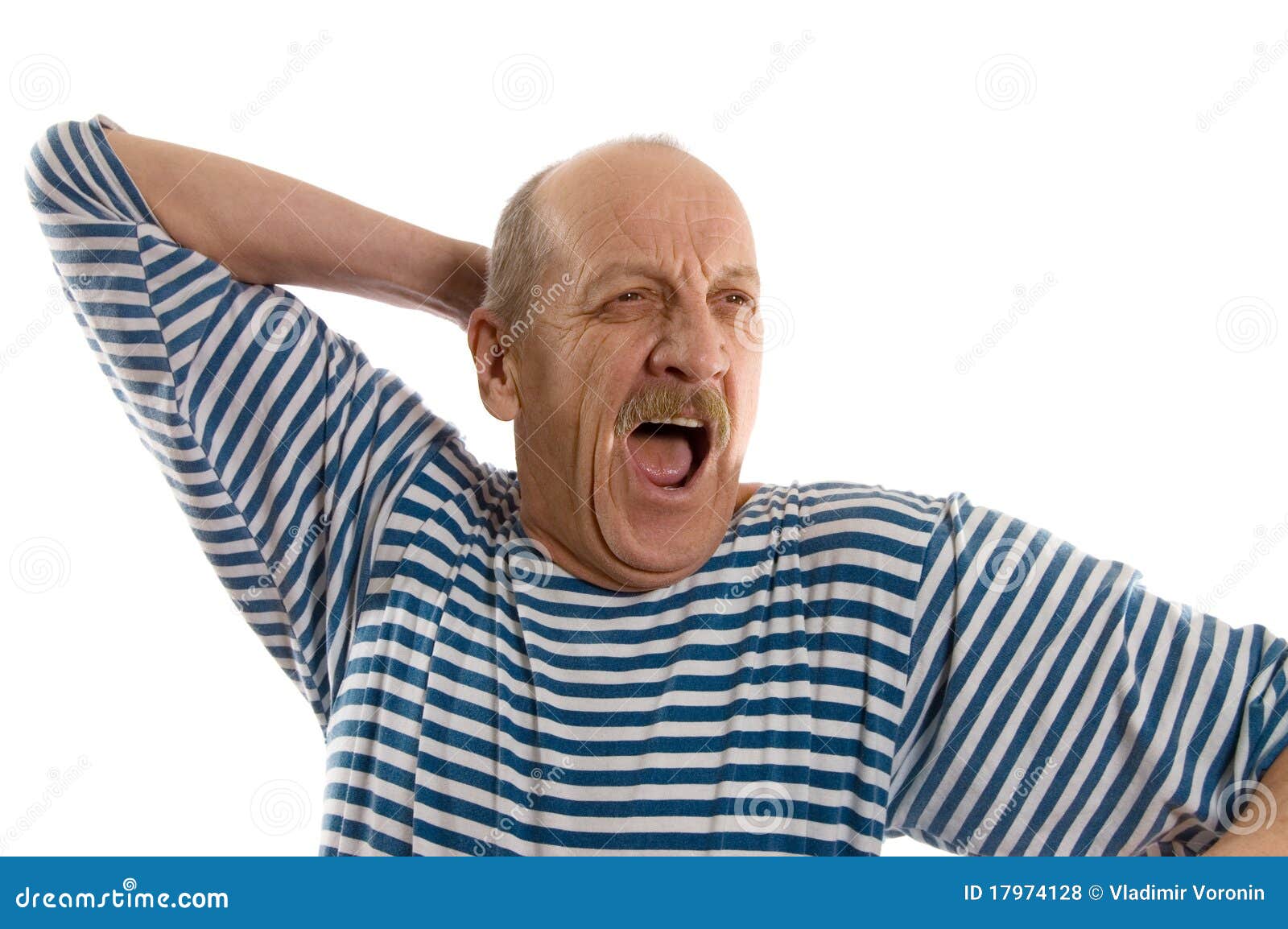 elderly man in a stripped vest yawns