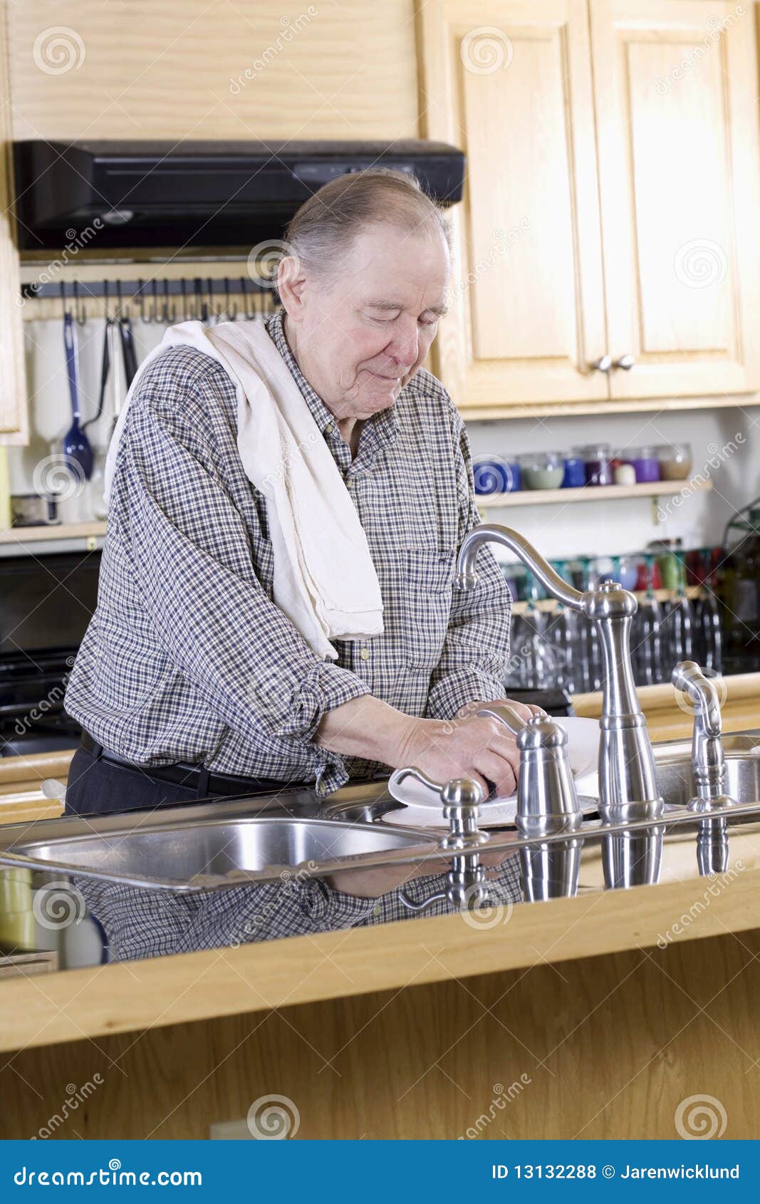 Elderly man washing dishes stock photo. Image of dishes 13132288