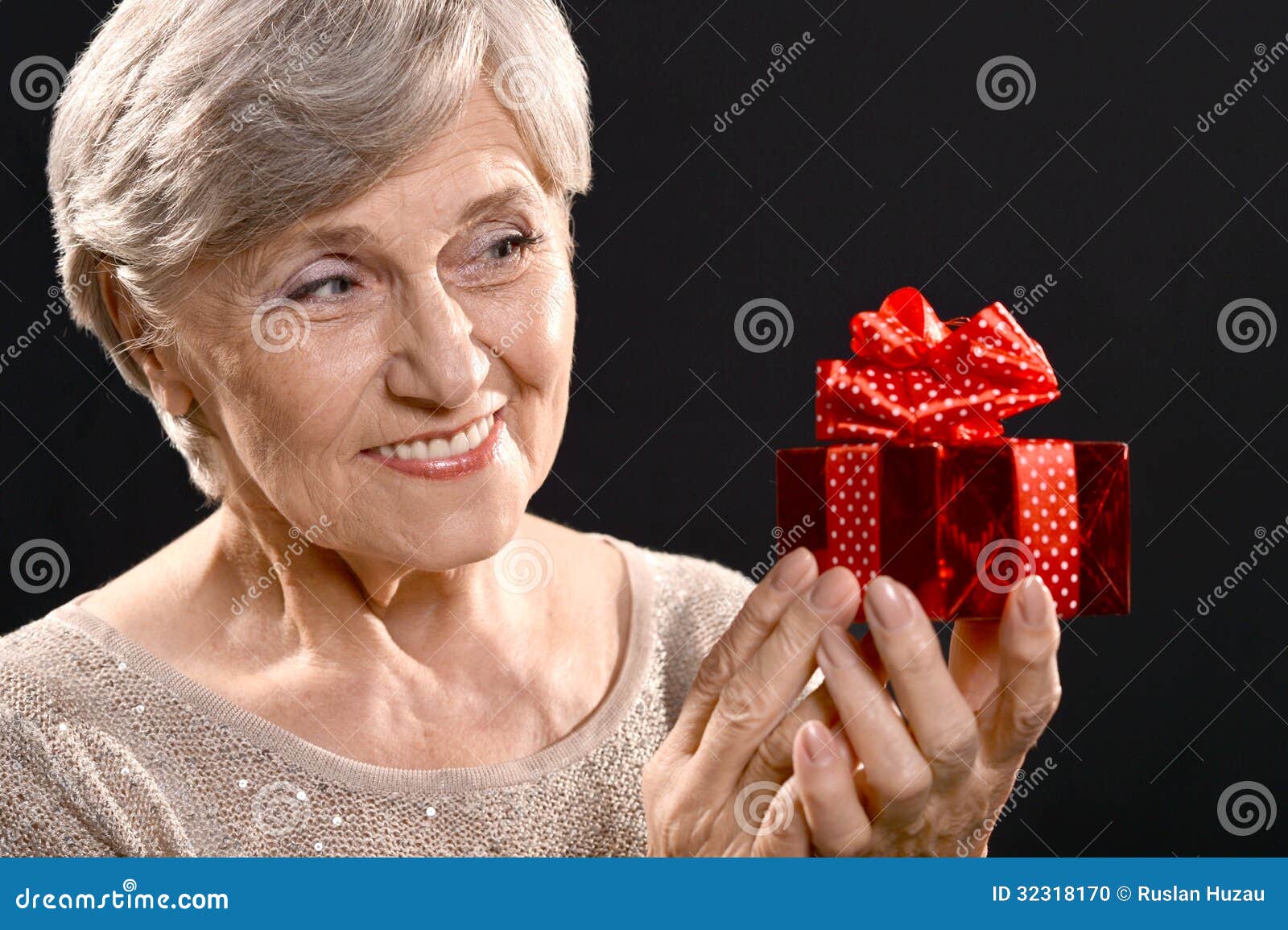 Elderly woman with a gift stock photo. Image of aged - 32318170