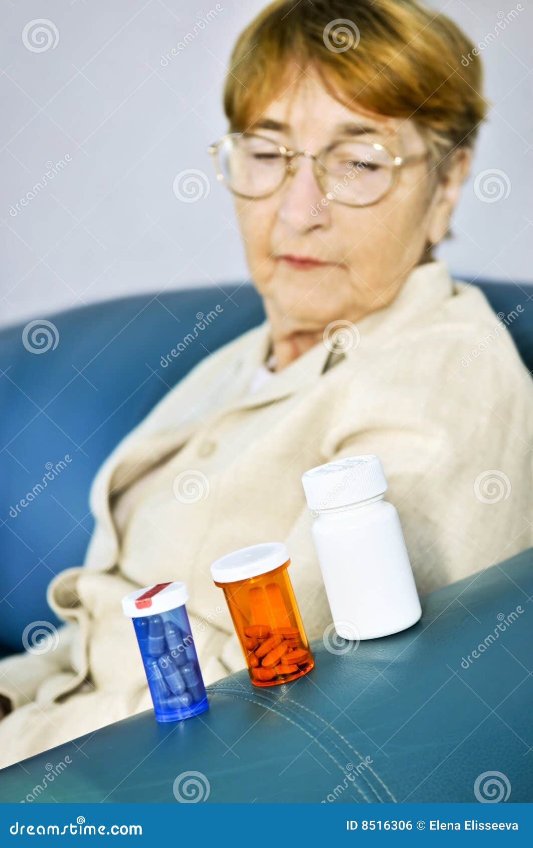 Elderly Woman Looking at Pill Bottles Stock Photo - Image of concerned